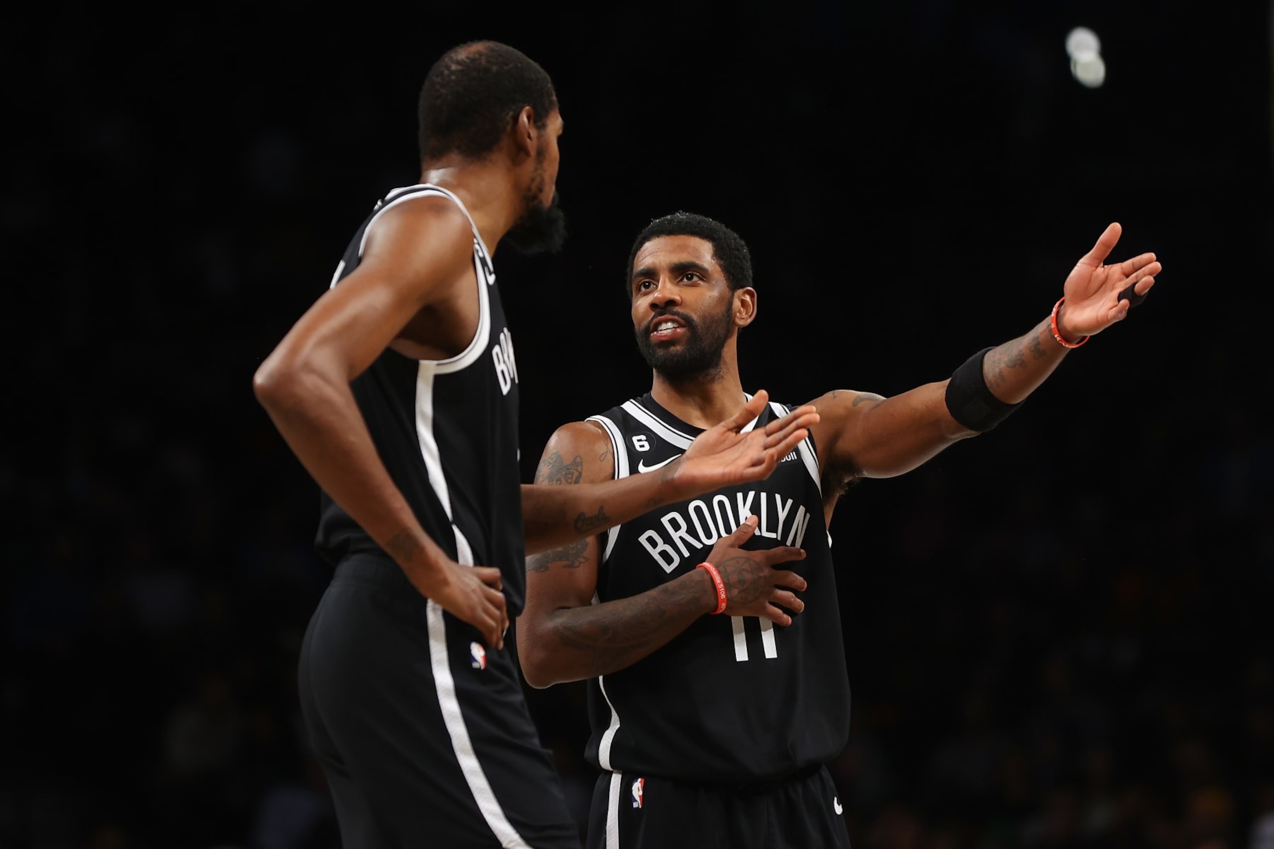 NEW YORK, NEW YORK - NOVEMBER 28: Kevin Durant #7 and Kyrie Irving #11 of the Brooklyn Nets in action against the Orlando Magic at Barclays Center on November 28, 2022 in New York City. NOTE TO USER: User expressly acknowledges and agrees that, by downloading and or using this Photograph, user is consenting to the terms and conditions of the Getty Images License Agreement. Brooklyn Nets defeated the Orlando Magic 109-102. (Photo by Mike Stobe/Getty Images)