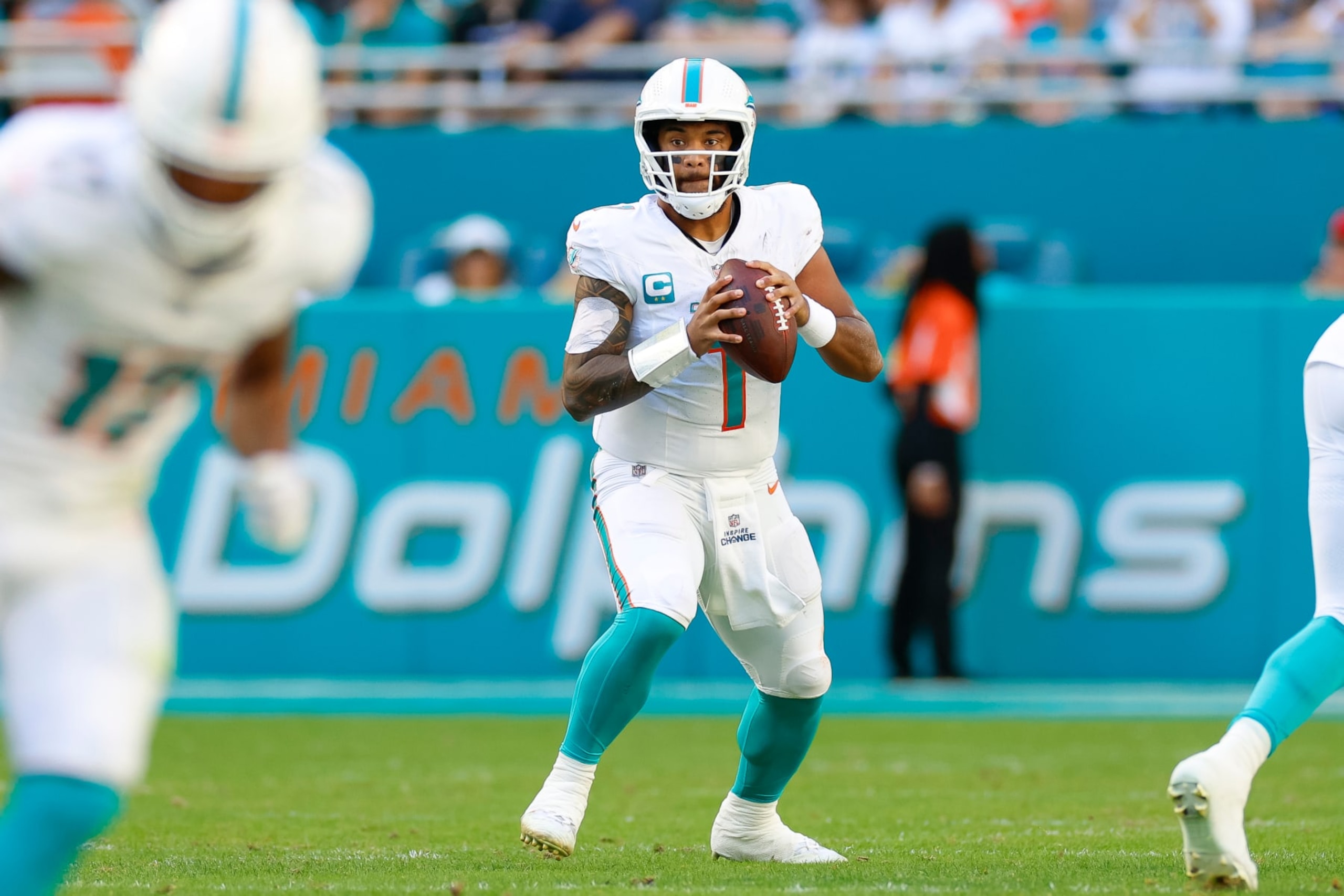 MIAMI GARDENS, FLORIDA - DECEMBER 17: Tua Tagovailoa #1 of the Miami Dolphins looks for an open receiver during a game against the New York Jets at Hard Rock Stadium on December 17, 2023 in Miami Gardens, Florida. (Photo by Brandon Sloter/Image Of Sport/Getty Images) MIAMI GARDENS, FLORIDA - DECEMBER 17: Tua Tagovailoa #1 of the Miami Dolphins looks for an open receiver during a game against the New York Jets at Hard Rock Stadium on December 17, 2023 in Miami Gardens, Florida. (Photo by Brandon Sloter/Image Of Sport/Getty Images)