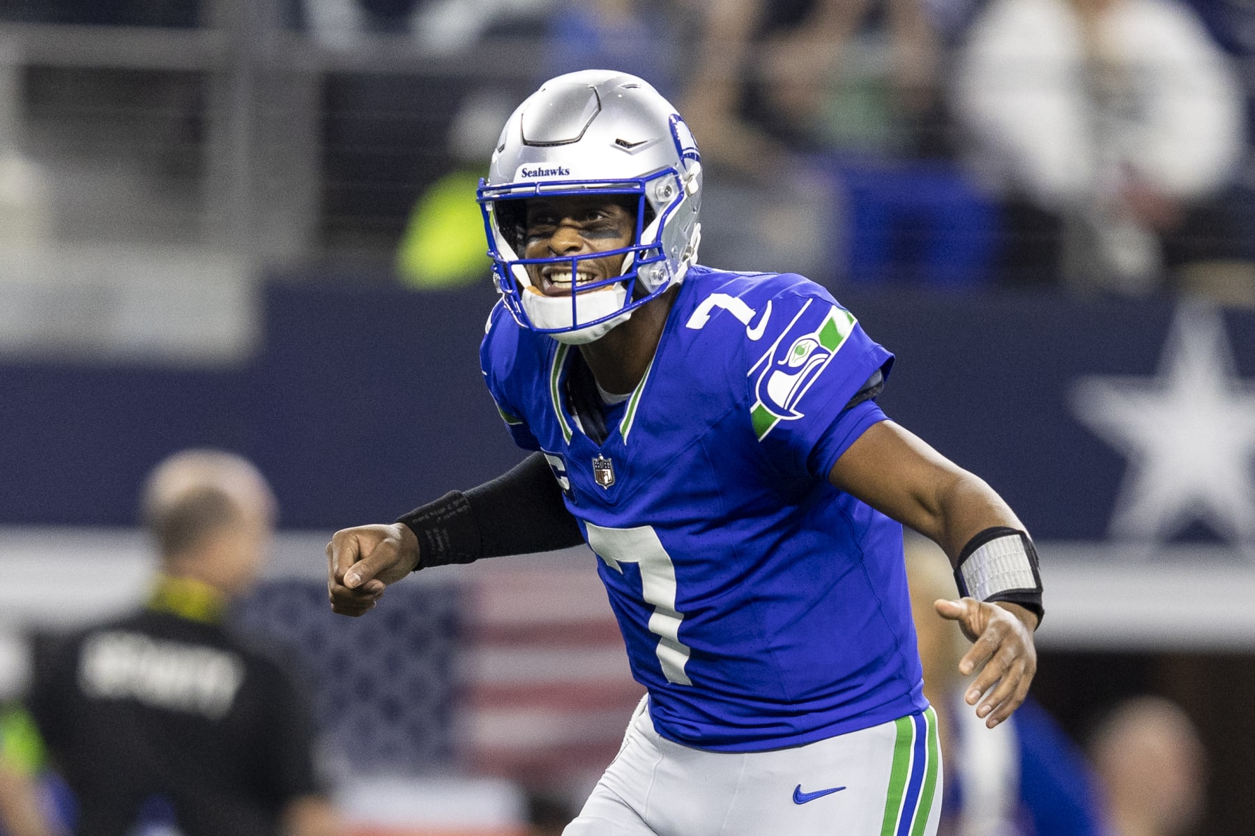 ARLINGTON, TEXAS - NOVEMBER 30: Geno Smith #7 of the Seattle Seahawks celebrates after a touchdown during an NFL football game between the Dallas Cowboys and the Seattle Seahawks at AT&T Stadium on November 30, 2023 in Arlington, Texas. (Photo by Michael Owens/Getty Images)