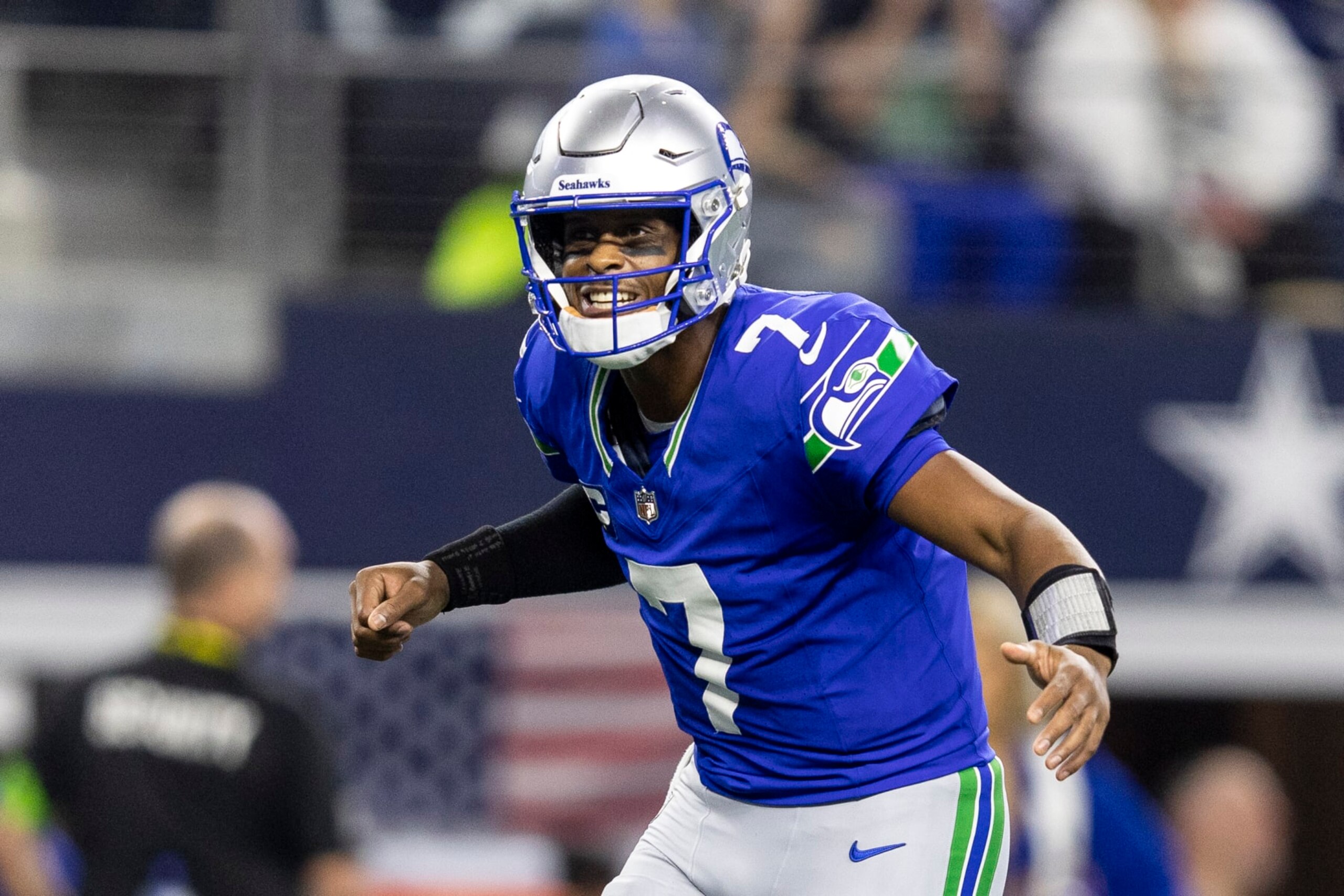 ARLINGTON, TEXAS - NOVEMBER 30: Geno Smith #7 of the Seattle Seahawks celebrates after a touchdown during an NFL football game between the Dallas Cowboys and the Seattle Seahawks at AT&T Stadium on November 30, 2023 in Arlington, Texas. (Photo by Michael Owens/Getty Images)