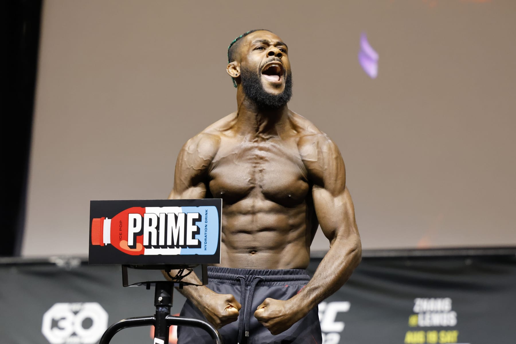 UFC Bantamweight Champion Aljamain Sterling poses at a ceremonial weigh-in for the UFC 292 mixed martial arts event, Friday, August 18, 2023, in Boston. He is scheduled to fight Sean O'Malley Saturday in Boston. (AP Photo/Gregory Payan)