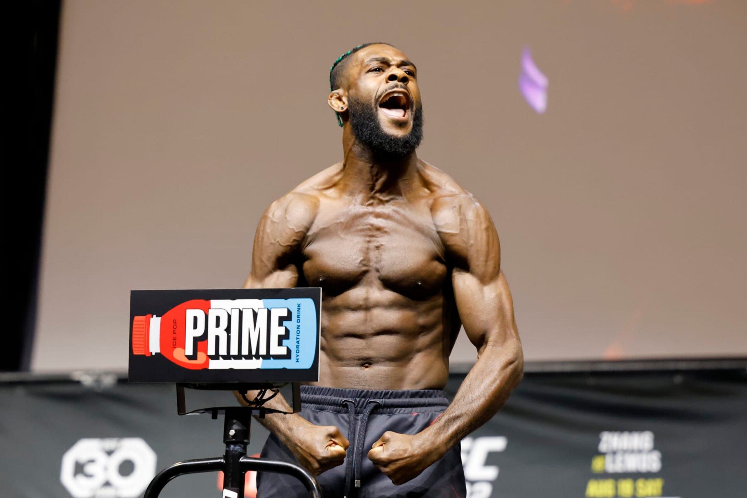 UFC Bantamweight Champion Aljamain Sterling poses at a ceremonial weigh-in for the UFC 292 mixed martial arts event, Friday, August 18, 2023, in Boston. He is scheduled to fight Sean O'Malley Saturday in Boston. (AP Photo/Gregory Payan)