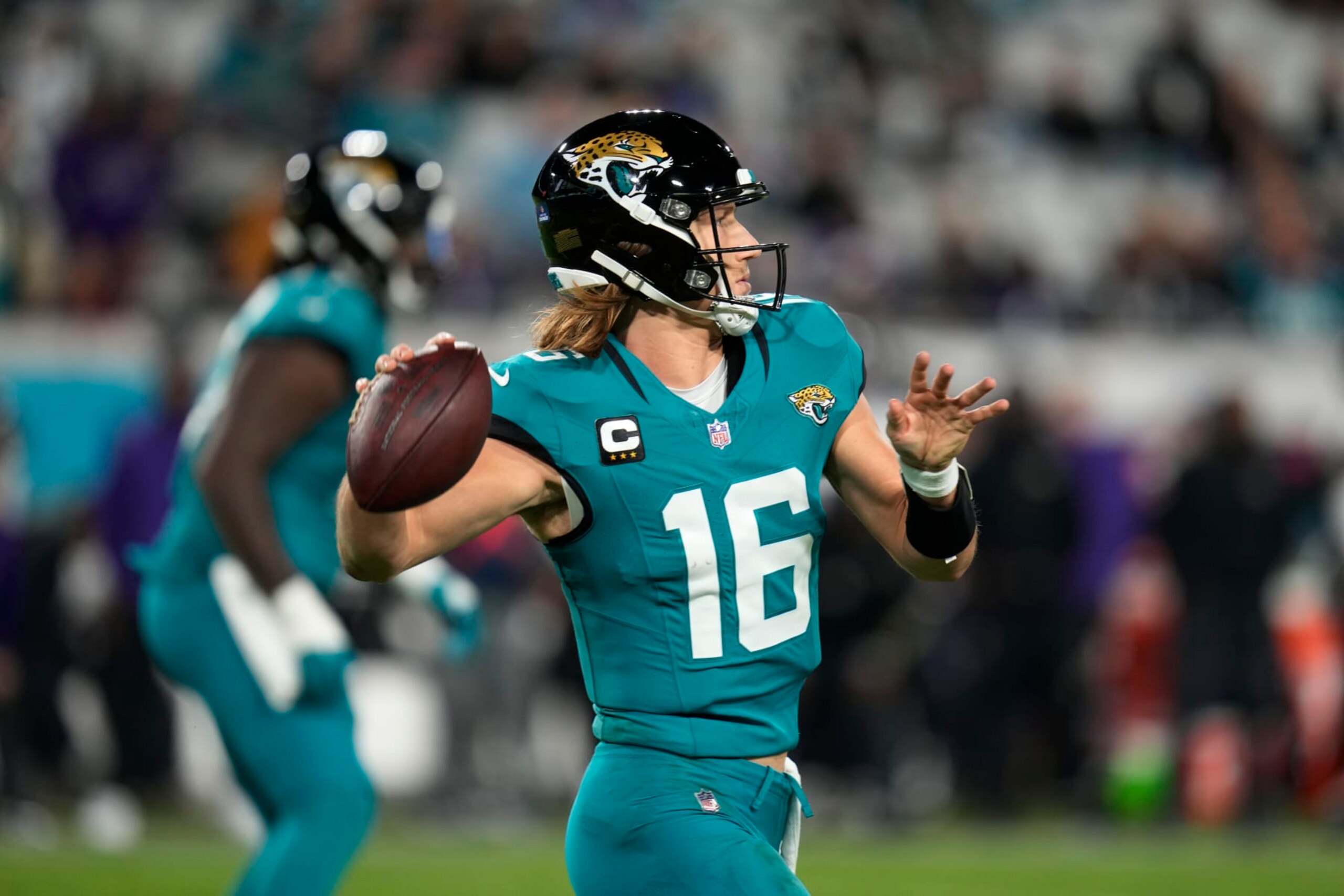 Jacksonville Jaguars quarterback Trevor Lawrence (16) passes against the Baltimore Ravens in the second half of an NFL football game Sunday, Dec. 17, 2023, in Jacksonville, Fla. (AP Photo/John Raoux)
