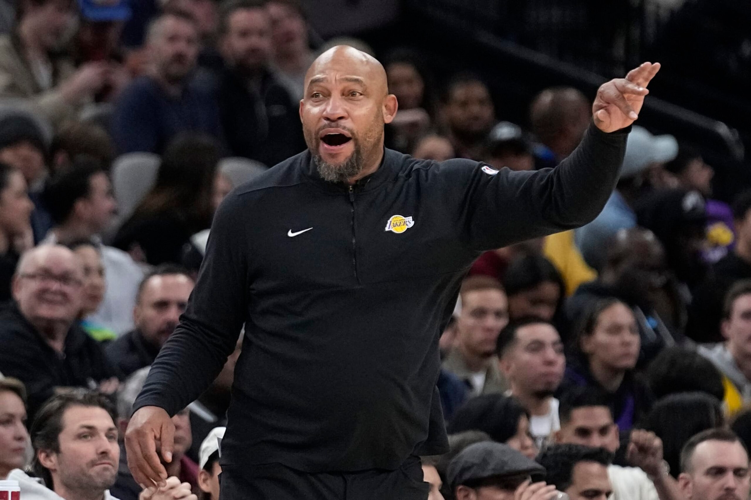 Los Angeles Lakers coach Darvin Ham signals to players during the first half of the team's NBA basketball game against the San Antonio Spurs in San Antonio, Friday, Dec. 15, 2023. (AP Photo/Eric Gay)