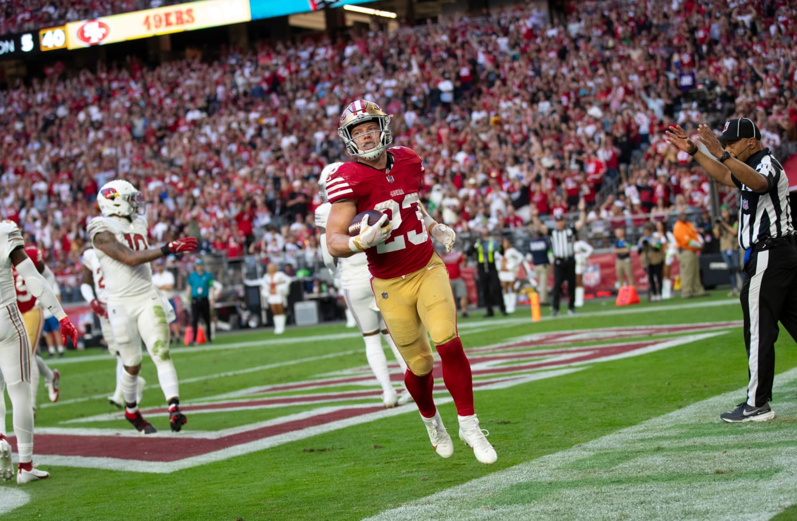 GLENDALE, AZ - DECEMBER 17: Christian McCaffrey #23 of the San Francisco 49ers in the end zone after making a 5-yard touchdown catch during the game against the Arizona Cardinals at State Farm Stadium on December 17, 2023 in Glendale, Arizona. The 49ers defeated the Cardinals 45-29. (Photo by Michael Zagaris/San Francisco 49ers/Getty Images)