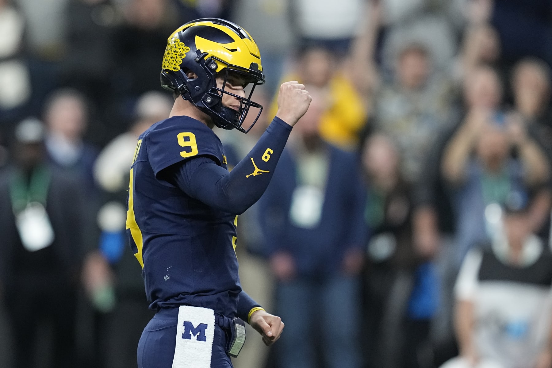 Michigan quarterback J.J. McCarthy celebrates a touchdown during the second half of the Big Ten championship NCAA college football game against Purdue, Saturday, Dec. 3, 2022, in Indianapolis. (AP Photo/Darron Cummings)