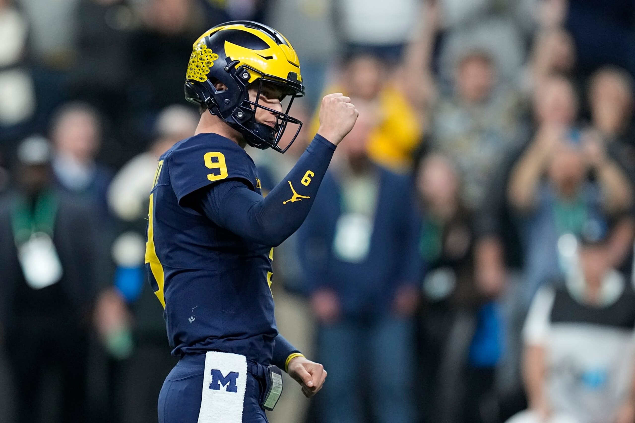 Michigan quarterback J.J. McCarthy celebrates a touchdown during the second half of the Big Ten championship NCAA college football game against Purdue, Saturday, Dec. 3, 2022, in Indianapolis. (AP Photo/Darron Cummings) Michigan quarterback J.J. McCarthy celebrates a touchdown during the second half of the Big Ten championship NCAA college football game against Purdue, Saturday, Dec. 3, 2022, in Indianapolis. (AP Photo/Darron Cummings)