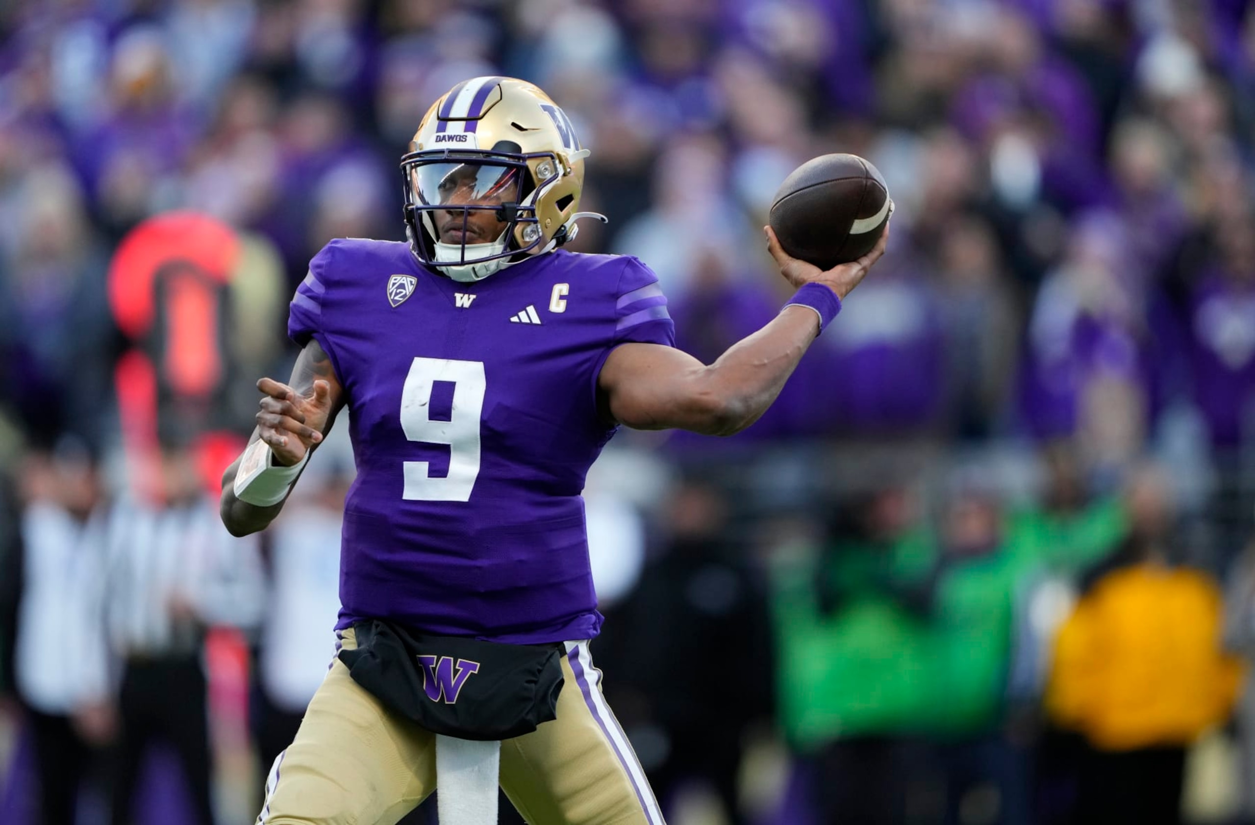 Washington quarterback Michael Penix Jr. (9) throws against Washington State during the second half of an NCAA college football game Saturday, Nov. 25, 2023, in Seattle. Washington won 24-21. (AP Photo/Lindsey Wasson) Washington quarterback Michael Penix Jr. (9) throws against Washington State during the second half of an NCAA college football game Saturday, Nov. 25, 2023, in Seattle. Washington won 24-21. (AP Photo/Lindsey Wasson)