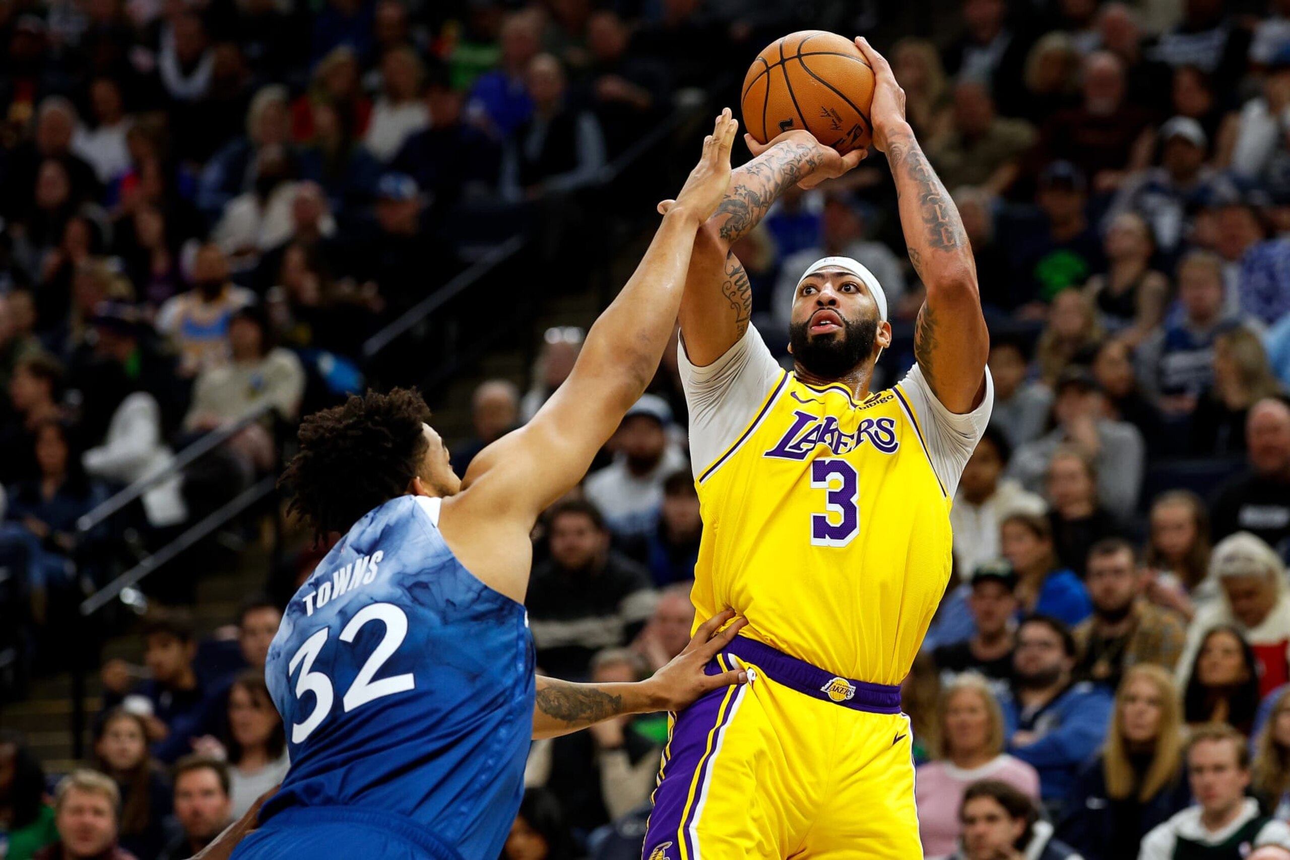 MINNEAPOLIS, MINNESOTA - DECEMBER 21: Anthony Davis #3 of the Los Angeles Lakers shoots the ball while Karl-Anthony Towns #32 of the Minnesota Timberwolves defends in the third quarter at Target Center on December 21, 2023 in Minneapolis, Minnesota. The Timberwolves defeated the Lakers 118-111. NOTE TO USER: User expressly acknowledges and agrees that, by downloading and or using this photograph, User is consenting to the terms and conditions of the Getty Images License Agreement. (Photo by David Berding/Getty Images) MINNEAPOLIS, MINNESOTA - DECEMBER 21: Anthony Davis #3 of the Los Angeles Lakers shoots the ball while Karl-Anthony Towns #32 of the Minnesota Timberwolves defends in the third quarter at Target Center on December 21, 2023 in Minneapolis, Minnesota. The Timberwolves defeated the Lakers 118-111. NOTE TO USER: User expressly acknowledges and agrees that, by downloading and or using this photograph, User is consenting to the terms and conditions of the Getty Images License Agreement. (Photo by David Berding/Getty Images)