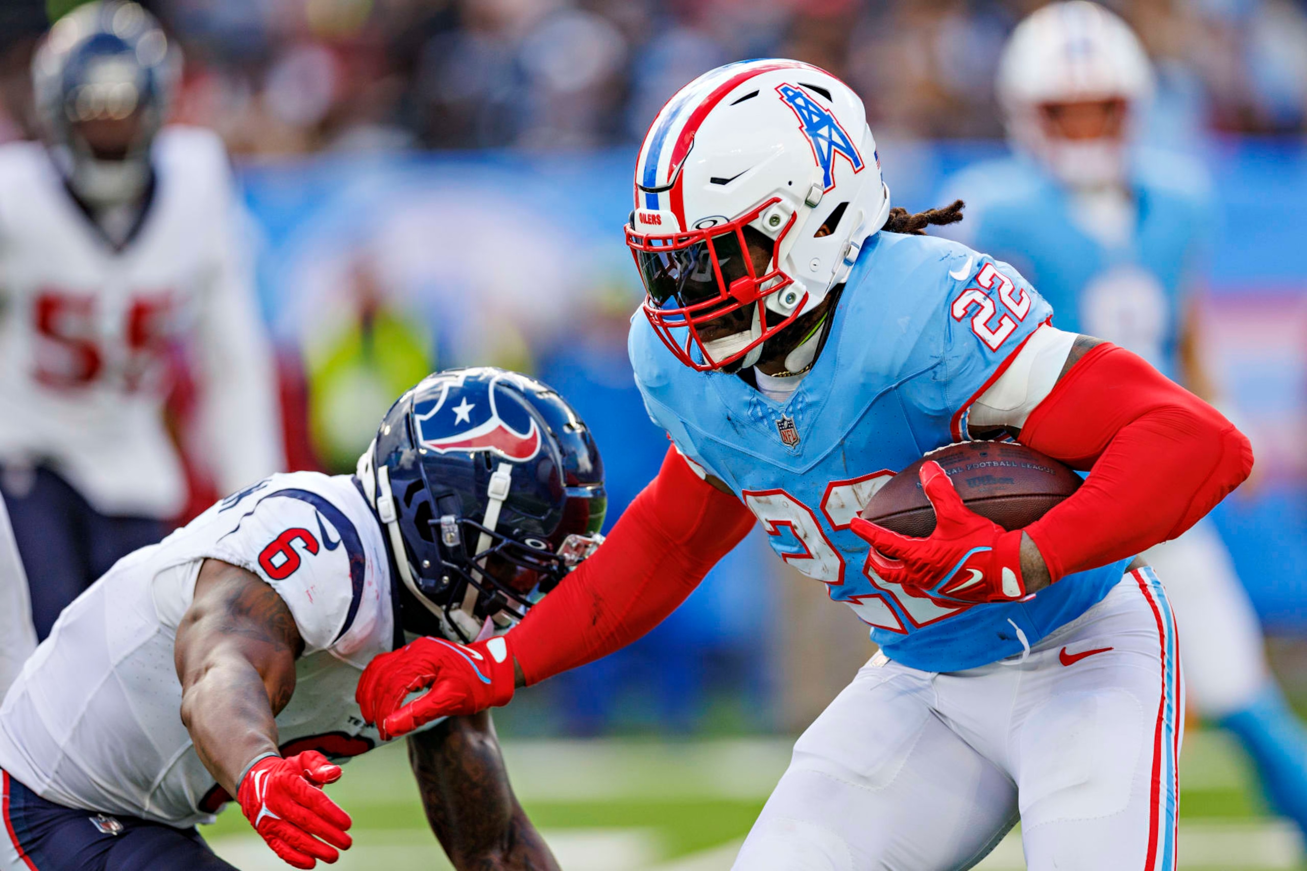 NASHVILLE, TENNESSEE - DECEMBER 17: Derrick Henry #22 of the Tennessee Titans runs the ball during a game against the Houston Texans at Nissan Stadium on December 17, 2023 in Nashville, Tennessee. The Texans defeated the Titans 19-16 in OT.  (Photo by Wesley Hitt/Getty Images)