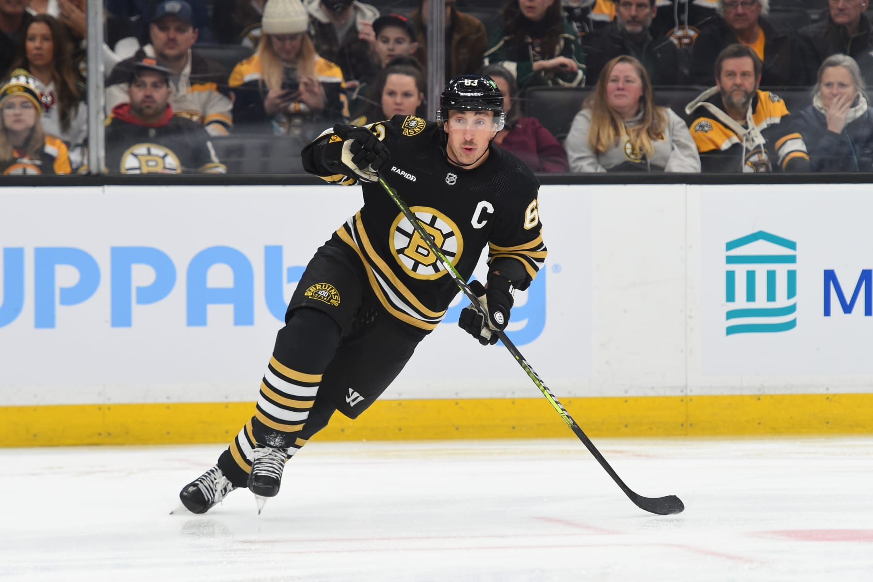 BOSTON, MASSACHUSETTS - DECEMBER 19: Brad Marchand #63 of the Boston Bruins skates against the Minnesota Wild on December 19, 2023 at the TD Garden in Boston, Massachusetts. (Photo by Steve Babineau/NHLI via Getty Images)