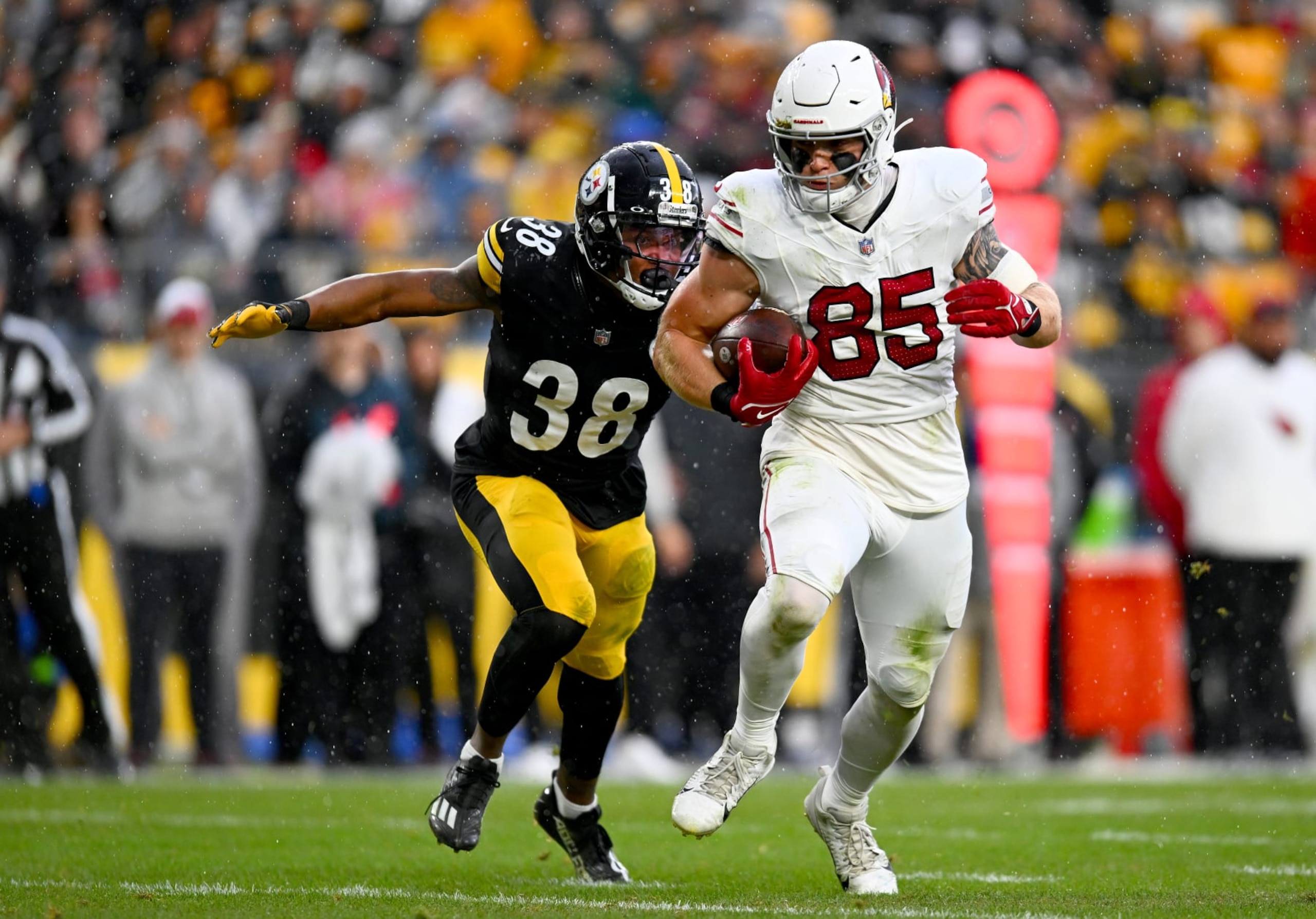 PITTSBURGH, PENNSYLVANIA - DECEMBER 03: Trey McBride #85 of the Arizona Cardinals is chased by Mykal Walker #38 of the Pittsburgh Steelers during the second quarter at Acrisure Stadium on December 03, 2023 in Pittsburgh, Pennsylvania. (Photo by Joe Sargent/Getty Images)
