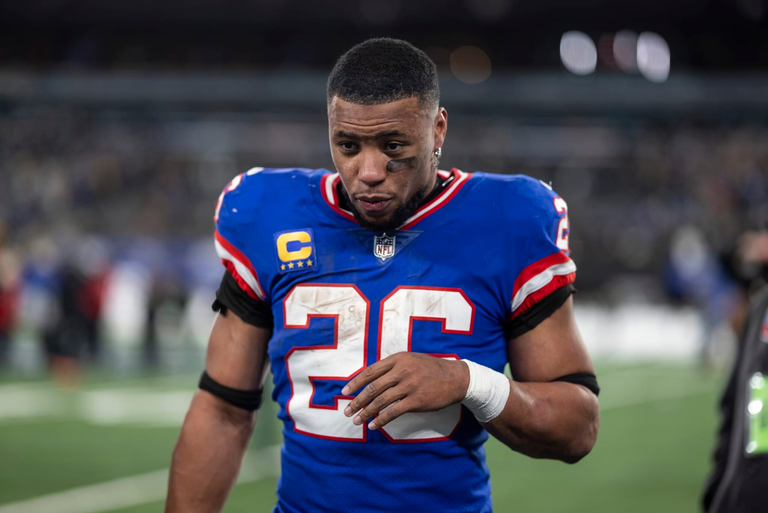 EAST RUTHERFORD, NEW JERSEY - DECEMBER 11: Saquon Barkley #26 of the New York Giants reacts as he walks off the field following an NFL football game between the New York Giants and the Green Bay Packers at MetLife Stadium on December 11, 2023 in East Rutherford, New Jersey. (Photo by Michael Owens/Getty Images)