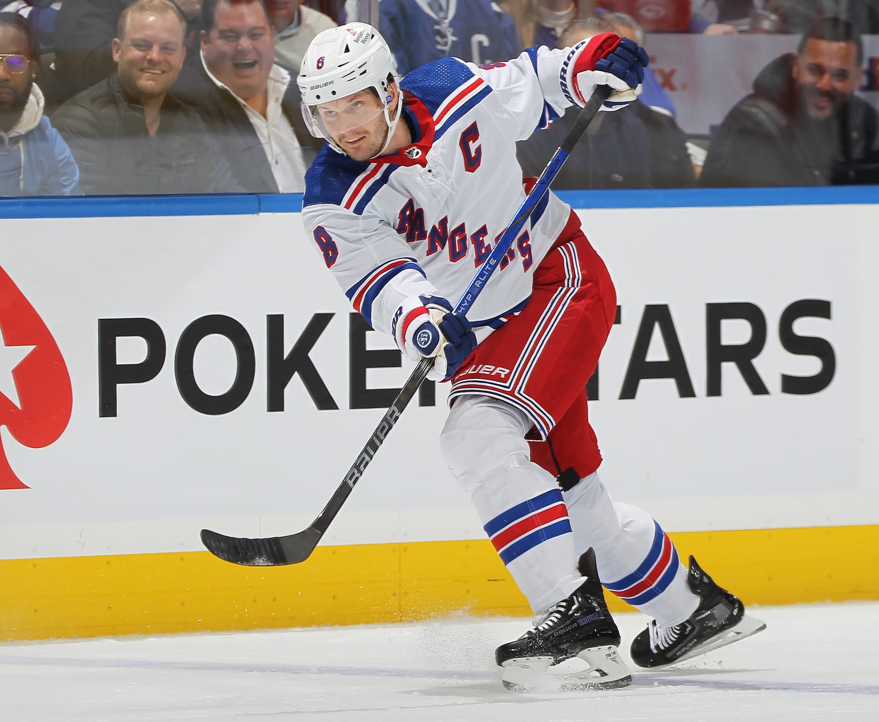 TORONTO, CANADA - DECEMBER 19:  Jacob Trouba #8 of the New York Rangers fires a shot against the Toronto Maple Leafs during the first period in an NHL game at Scotiabank Arena on December 19, 2023 in Toronto, Ontario, Canada. The Rangers defeated the Maple Leafs 5-2. (Photo by Claus Andersen/Getty Images)