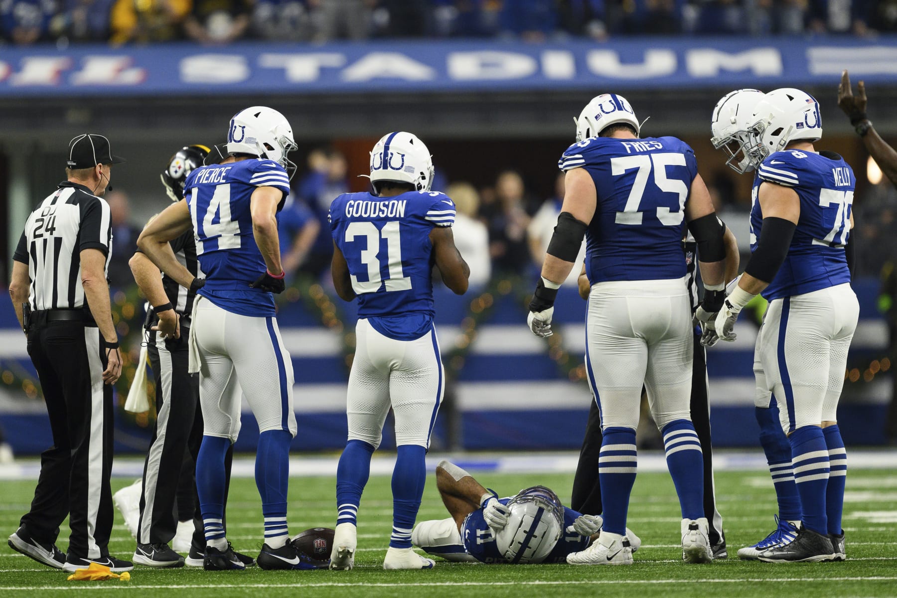 Indianapolis Colts wide receiver Michael Pittman Jr. (11) lays on the field after getting injured as teammates huddle around during an NFL football game against the Pittsburgh Steelers, Saturday, Dec. 16, 2023, in Indianapolis. (AP Photo/Zach Bolinger) Indianapolis Colts wide receiver Michael Pittman Jr. (11) lays on the field after getting injured as teammates huddle around during an NFL football game against the Pittsburgh Steelers, Saturday, Dec. 16, 2023, in Indianapolis. (AP Photo/Zach Bolinger)