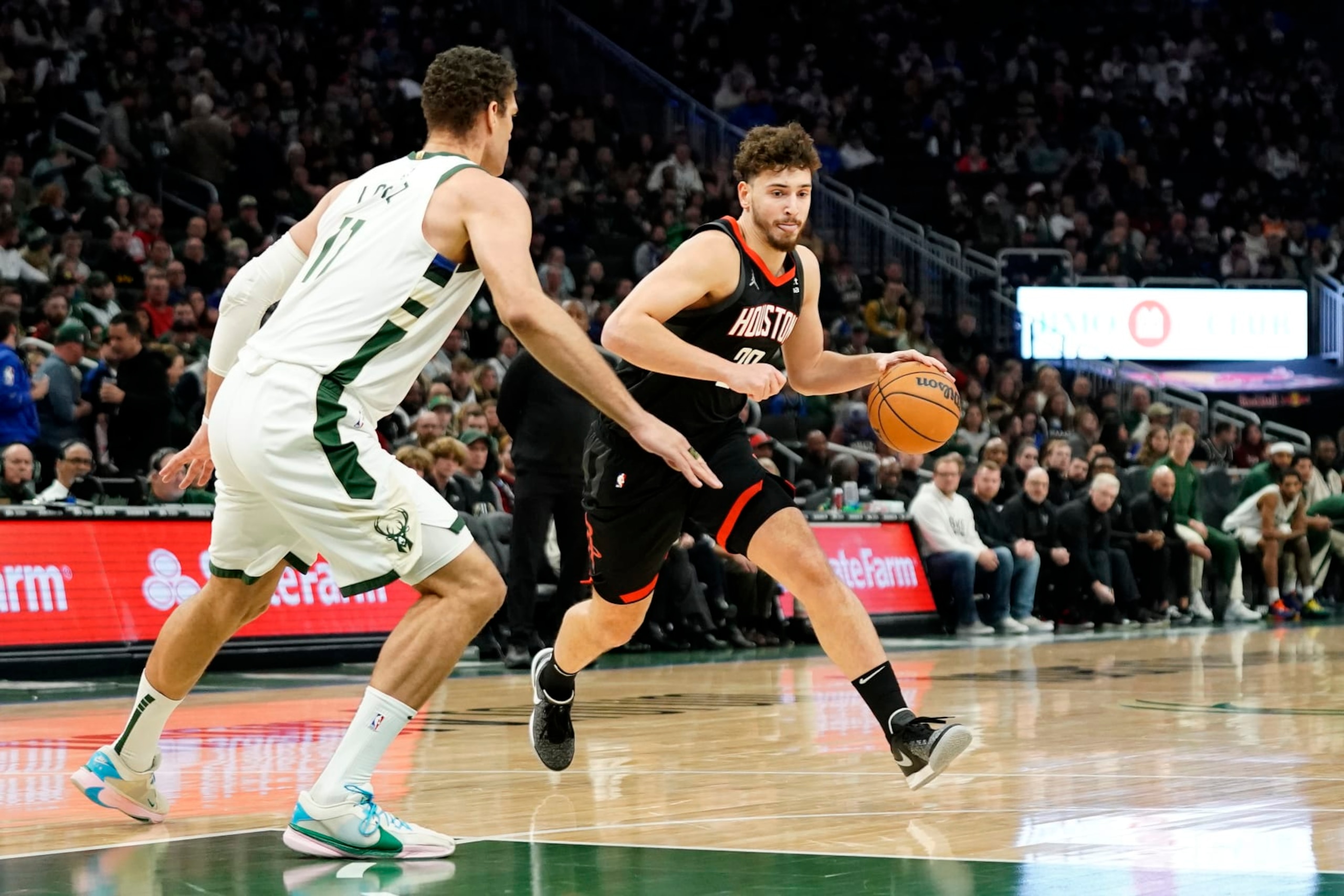 Houston Rockets' Alperen Sengun drives to the basket against Milwaukee Bucks' Brook Lopez during the first half of an NBA basketball game Sunday, Dec. 17, 2023, in Milwaukee. (AP Photo/Aaron Gash) Houston Rockets' Alperen Sengun drives to the basket against Milwaukee Bucks' Brook Lopez during the first half of an NBA basketball game Sunday, Dec. 17, 2023, in Milwaukee. (AP Photo/Aaron Gash)