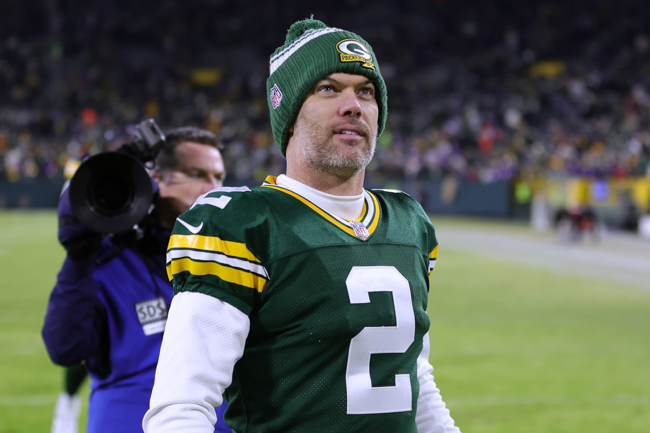 GREEN BAY, WISCONSIN - JANUARY 01: Mason Crosby #2 of the Green Bay Packers leaves the field after the game against the Minnesota Vikings at Lambeau Field on January 01, 2023 in Green Bay, Wisconsin. (Photo by Stacy Revere/Getty Images)