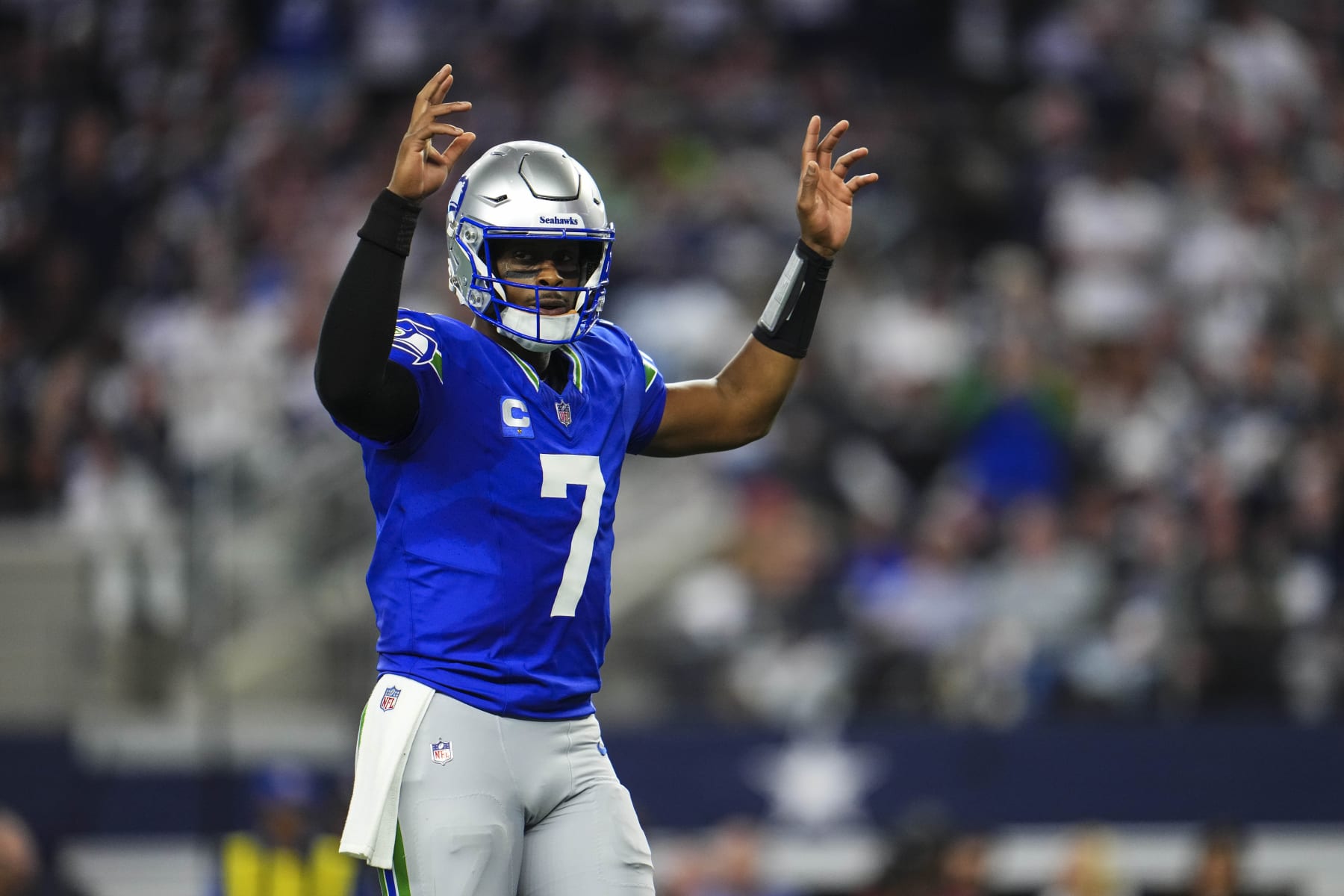 ARLINGTON, TX - NOVEMBER 30: Geno Smith #7 of the Seattle Seahawks celebrates during an NFL football game against the Dallas Cowboys at AT&T Stadium on November 30, 2023 in Arlington, Texas. (Photo by Cooper Neill/Getty Images)