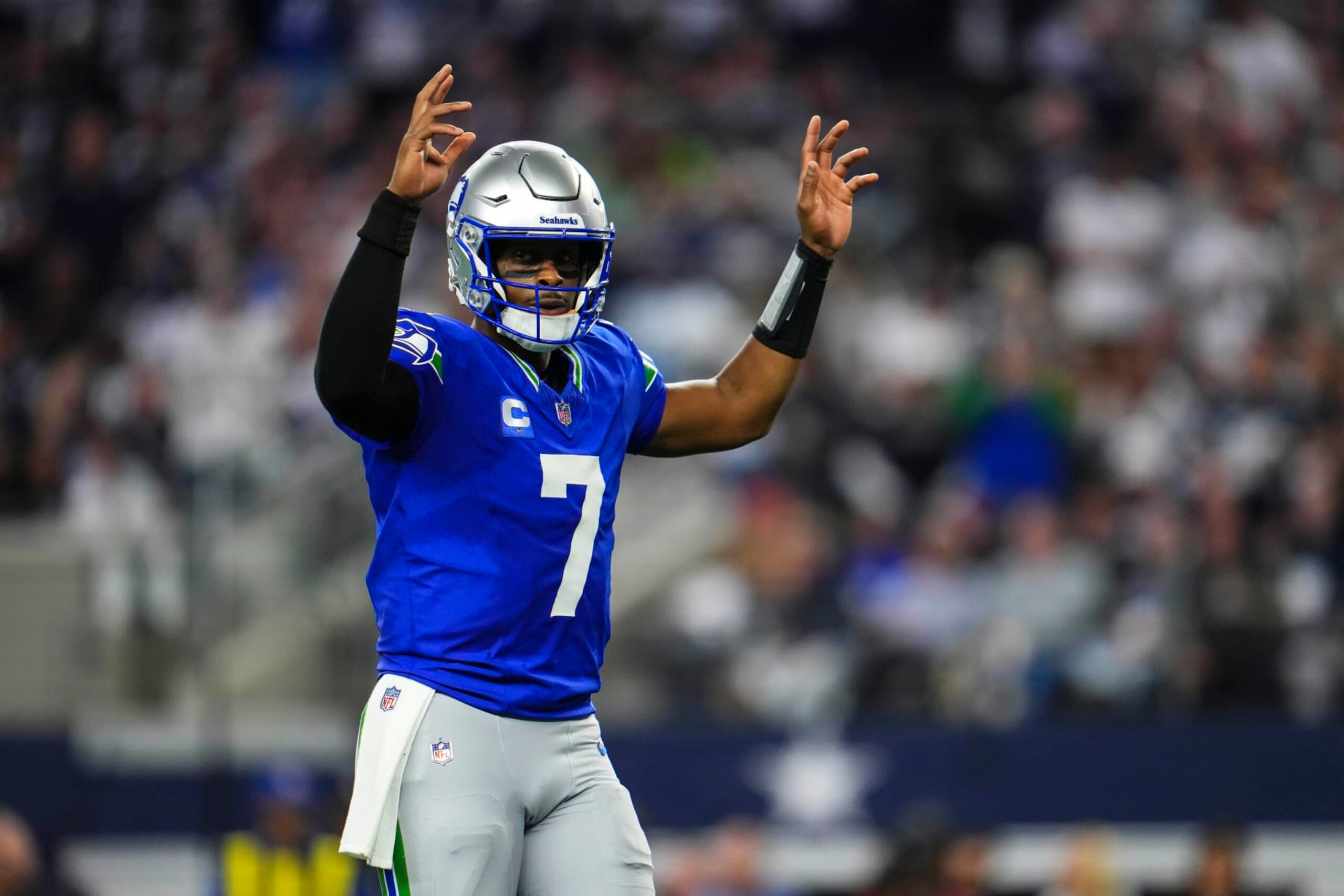 ARLINGTON, TX - NOVEMBER 30: Geno Smith #7 of the Seattle Seahawks celebrates during an NFL football game against the Dallas Cowboys at AT&T Stadium on November 30, 2023 in Arlington, Texas. (Photo by Cooper Neill/Getty Images)