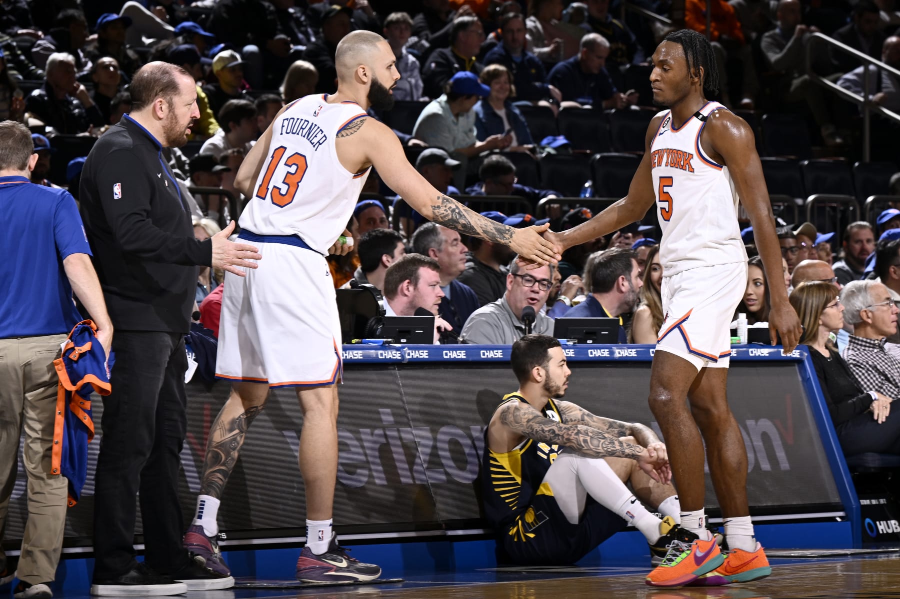 NEW YORK, NY - APRIL 9: Evan Fournier #13 of the New York Knicks high fives Immanuel Quickley #5 of the New York Knicks during the game against the Indiana Pacers on April 9, 2023 at Madison Square Garden in New York City, New York. NOTE TO USER: User expressly acknowledges and agrees that, by downloading and or using this photograph, User is consenting to the terms and conditions of the Getty Images License Agreement. Mandatory Copyright Notice: Copyright 2023 NBAE  (Photo by David Dow/NBAE via Getty Images)