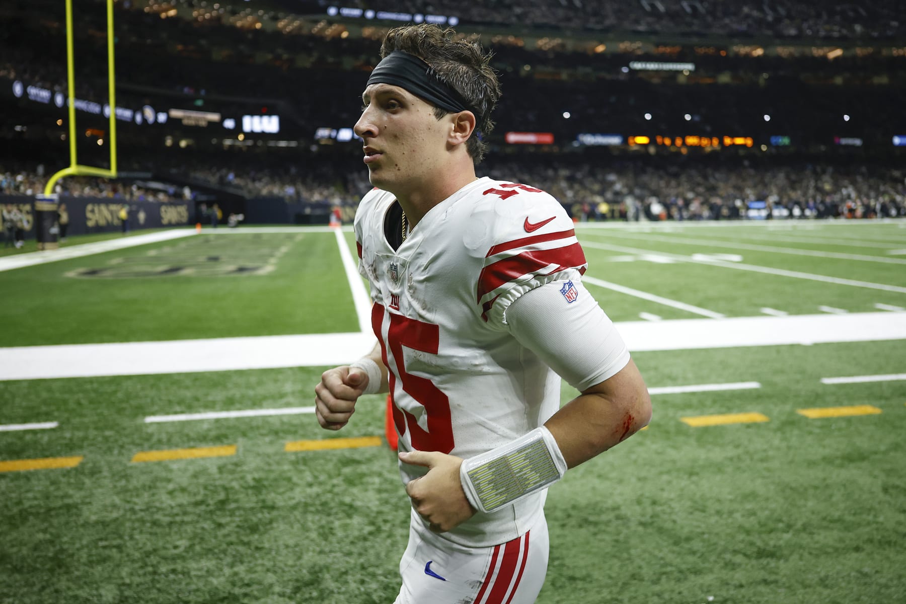 NEW ORLEANS, LOUISIANA - DECEMBER 17: Tommy DeVito #15 of the New York Giants walks off the field during the first half of the game against the New Orleans Saint at Caesars Superdome on December 17, 2023 in New Orleans, Louisiana. (Photo by Chris Graythen/Getty Images)