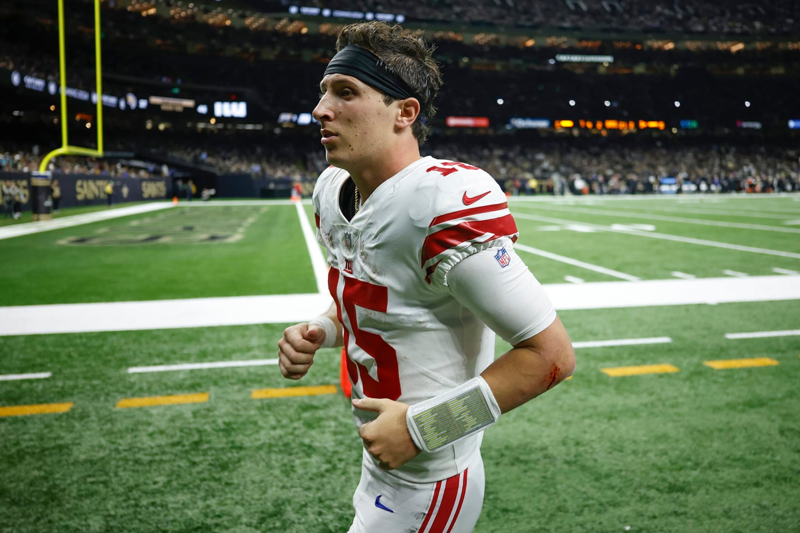 NEW ORLEANS, LOUISIANA - DECEMBER 17: Tommy DeVito #15 of the New York Giants walks off the field during the first half of the game against the New Orleans Saint at Caesars Superdome on December 17, 2023 in New Orleans, Louisiana. (Photo by Chris Graythen/Getty Images)