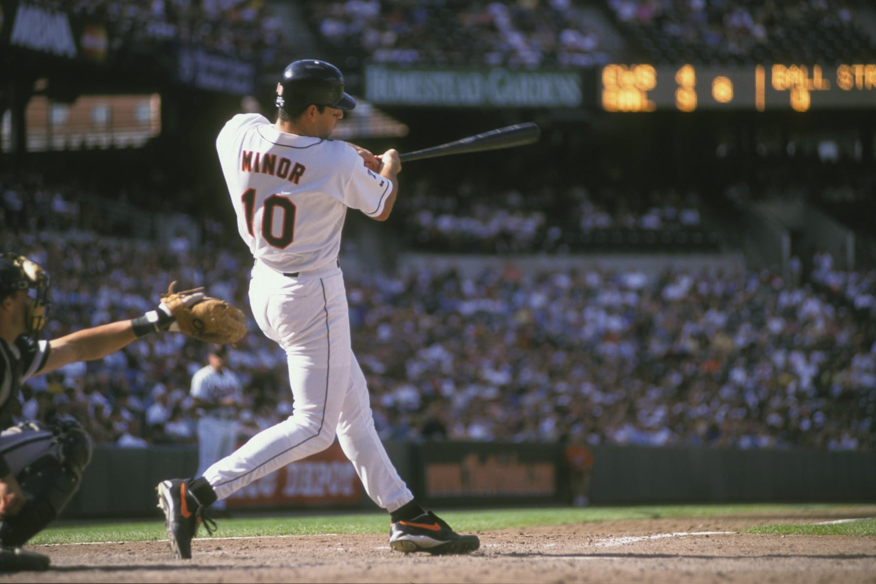 BALTIMORE, MD - SEPTEMBER 4:  Ryan Minor #10 of the Baltimore Orioles prepares to field a ground ball during a baseball game against the Cleveland Indians on Septrmber 4, 1999 at Camden Yards in Baltimore, Maryland.  (Photo by Mitchell Layton/Getty Images)