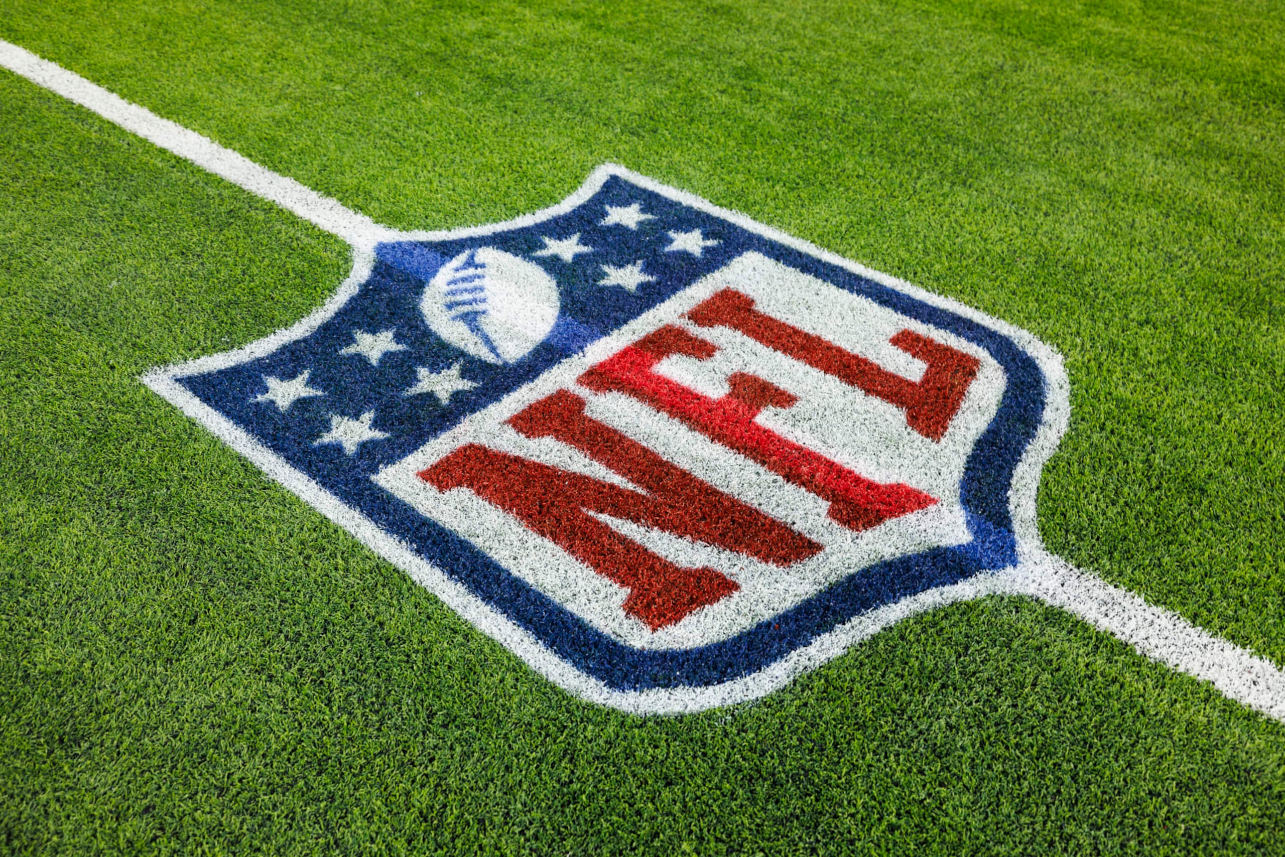 INGLEWOOD, CALIFORNIA - DECEMBER 03: A detail view of an NFL shield logo on the field during a game between the Cleveland Browns and the Los Angeles Rams at SoFi Stadium on December 03, 2023 in Inglewood, California. (Photo by Ric Tapia/Getty Images)
