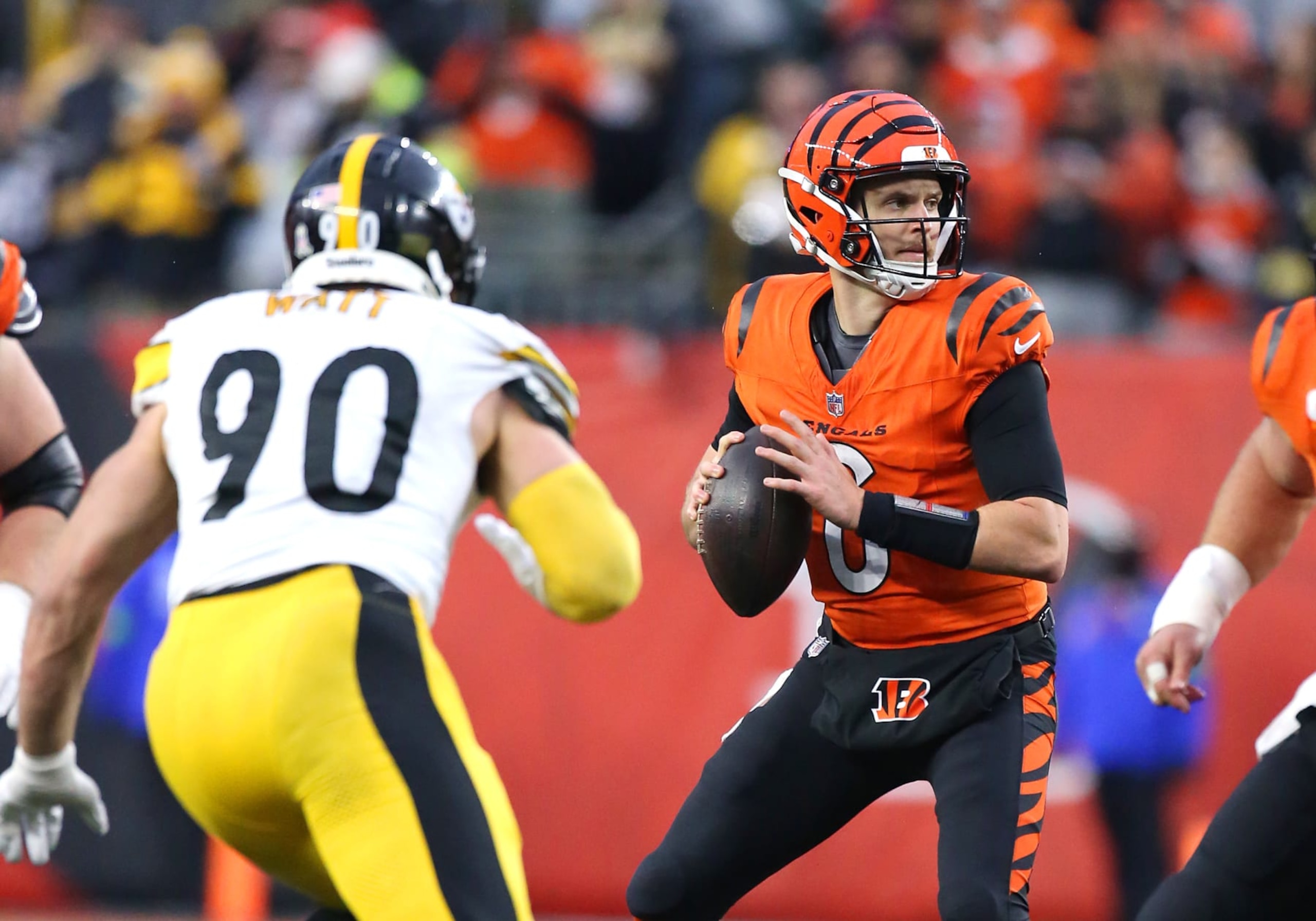 CINCINNATI, OH - NOVEMBER 26: Cincinnati Bengals quarterback Jake Browning (6) is pursued by Pittsburgh Steelers linebacker T.J. Watt (90) in a game between the Pittsburgh Steelers and the Cincinnati Bengals at Paycor Stadium on Sunday, November. 26, 2023. (Photo by Jeff Moreland/Icon Sportswire via Getty Images)