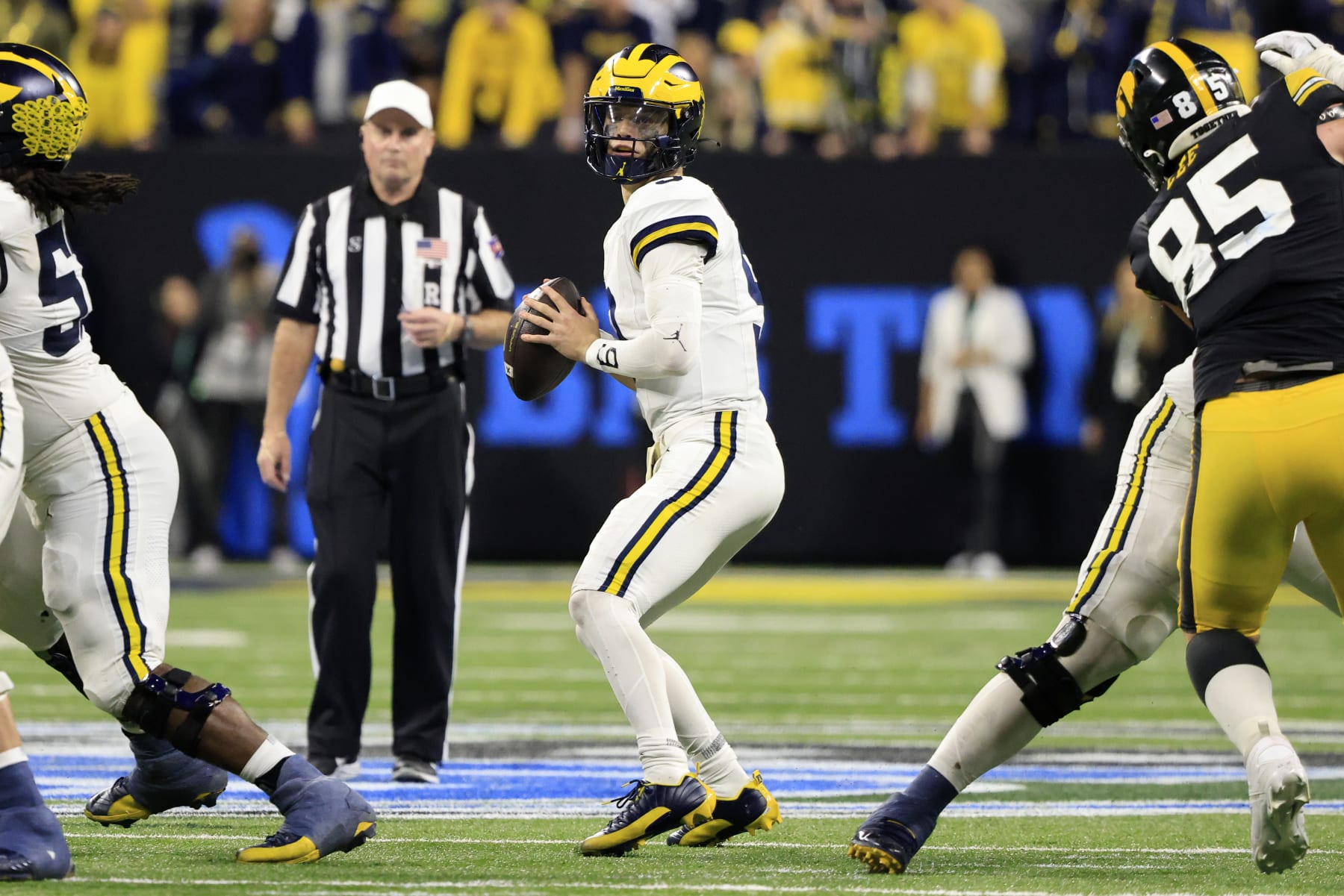 INDIANAPOLIS, INDIANA - DECEMBER 02: J.J. McCarthy #9 of the Michigan Wolverines looks to pass in the game against the Iowa Hawkeyes during the Big Ten Championship at Lucas Oil Stadium on December 02, 2023 in Indianapolis, Indiana. (Photo by Justin Casterline/Getty Images)