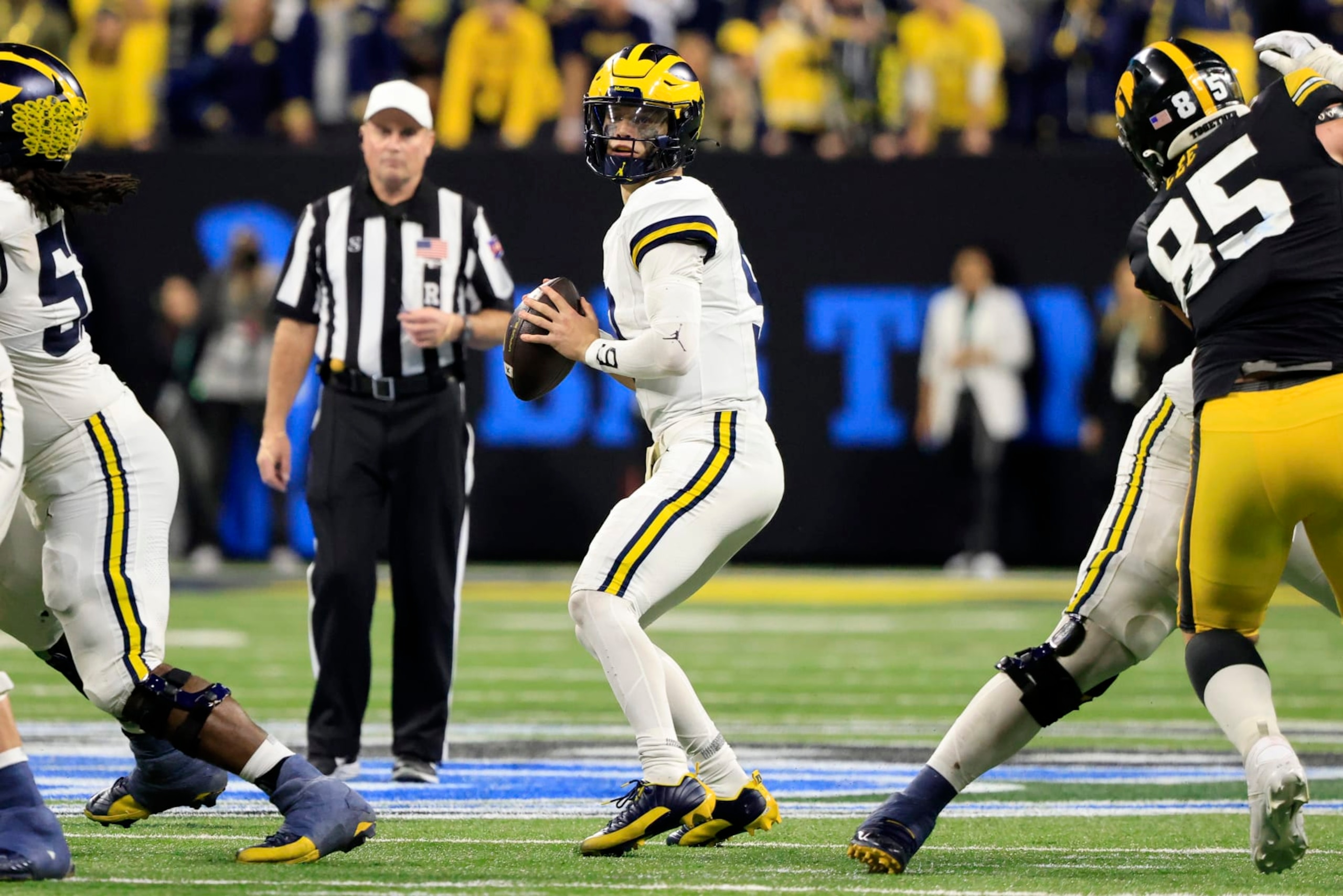 INDIANAPOLIS, INDIANA - DECEMBER 02: J.J. McCarthy #9 of the Michigan Wolverines looks to pass in the game against the Iowa Hawkeyes during the Big Ten Championship at Lucas Oil Stadium on December 02, 2023 in Indianapolis, Indiana. (Photo by Justin Casterline/Getty Images) INDIANAPOLIS, INDIANA - DECEMBER 02: J.J. McCarthy #9 of the Michigan Wolverines looks to pass in the game against the Iowa Hawkeyes during the Big Ten Championship at Lucas Oil Stadium on December 02, 2023 in Indianapolis, Indiana. (Photo by Justin Casterline/Getty Images)