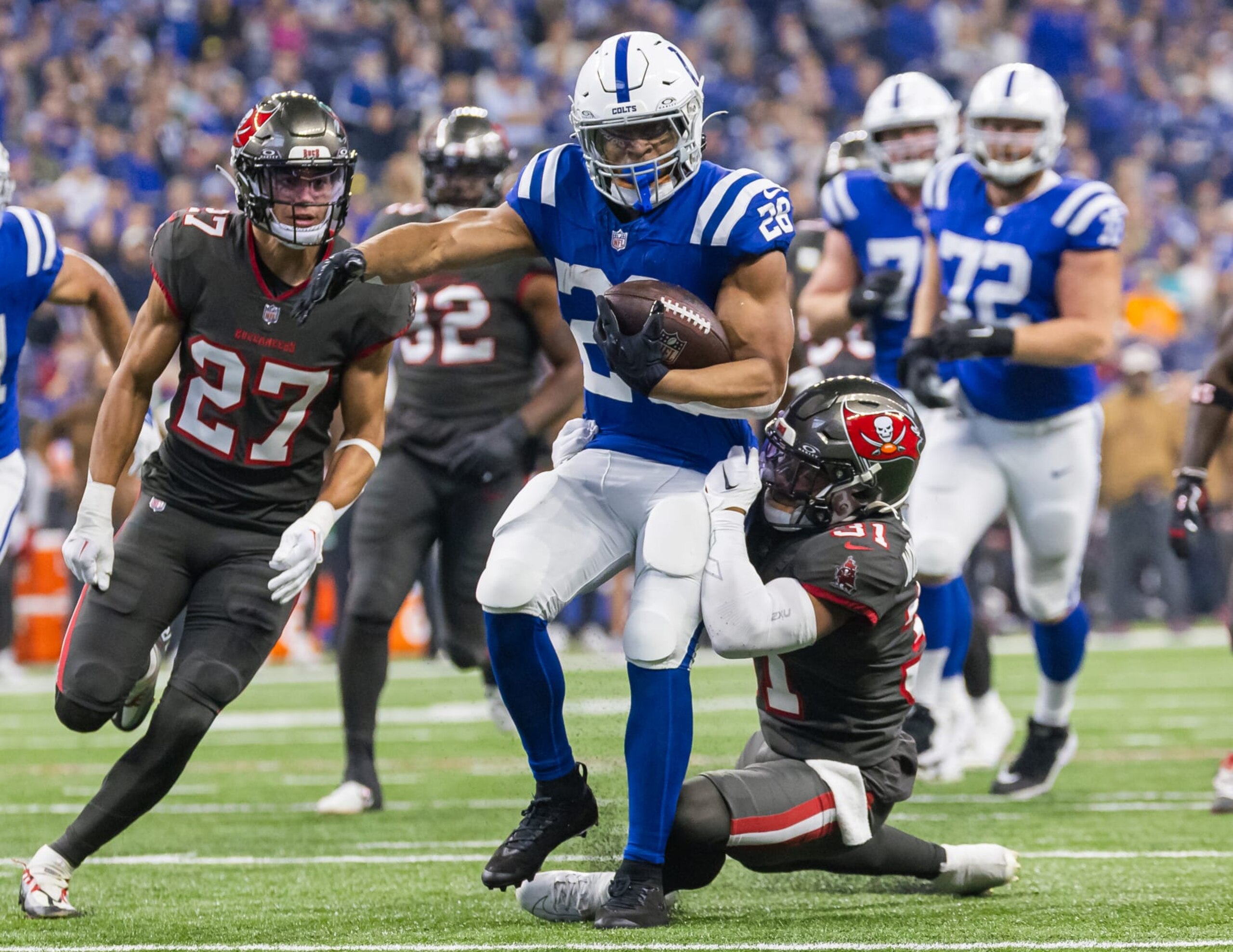 INDIANAPOLIS, INDIANA - NOVEMBER 26: Jonathan Taylor #28 of the Indianapolis Colts runs the ball during the game against the Tampa Bay Buccaneers at Lucas Oil Stadium on November 26, 2023 in Indianapolis, Indiana. (Photo by Michael Hickey/Getty Images)