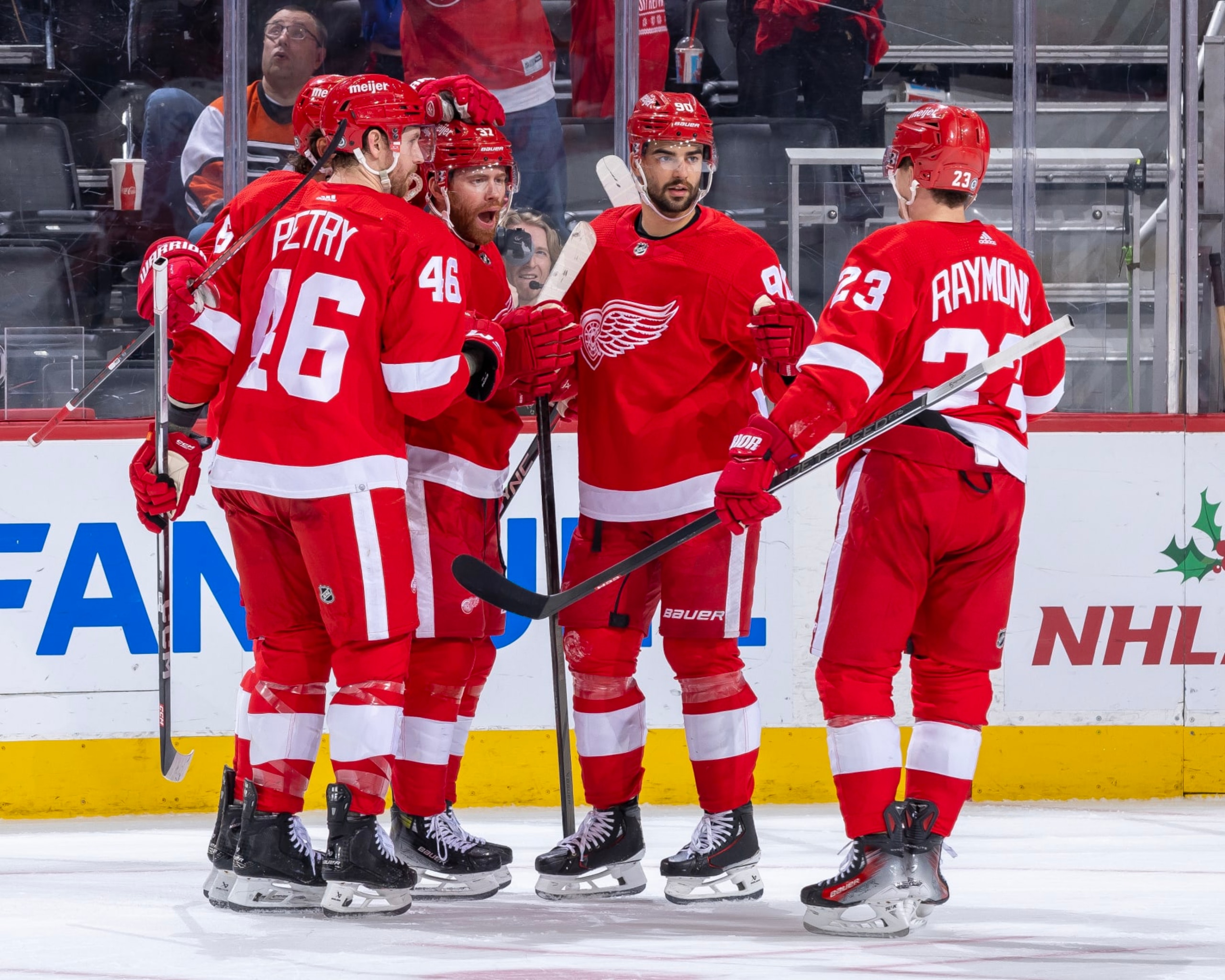 DETROIT, MI - DECEMBER 22: J.T. Compher #37 of the Detroit Red Wings celebrates his goal with teammates during the first period against the Philadelphia Flyers at Little Caesars Arena on December 22, 2023 in Detroit, Michigan. (Photo by Dave Reginek/NHLI via Getty Images)