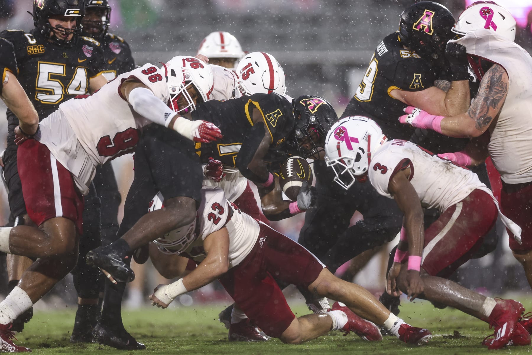 ORLANDO, FLORIDA - DECEMBER 16: Kanye Roberts #14 of the Appalachian State Mountaineers fumbles the ball during the first quarter of The Avocados From Mexico Cure Bowl against the Miami (Oh) Redhawks at FBC Mortgage Stadium on December 16, 2023 in Orlando, Florida. (Photo by Kevin Sabitus/Getty Images)