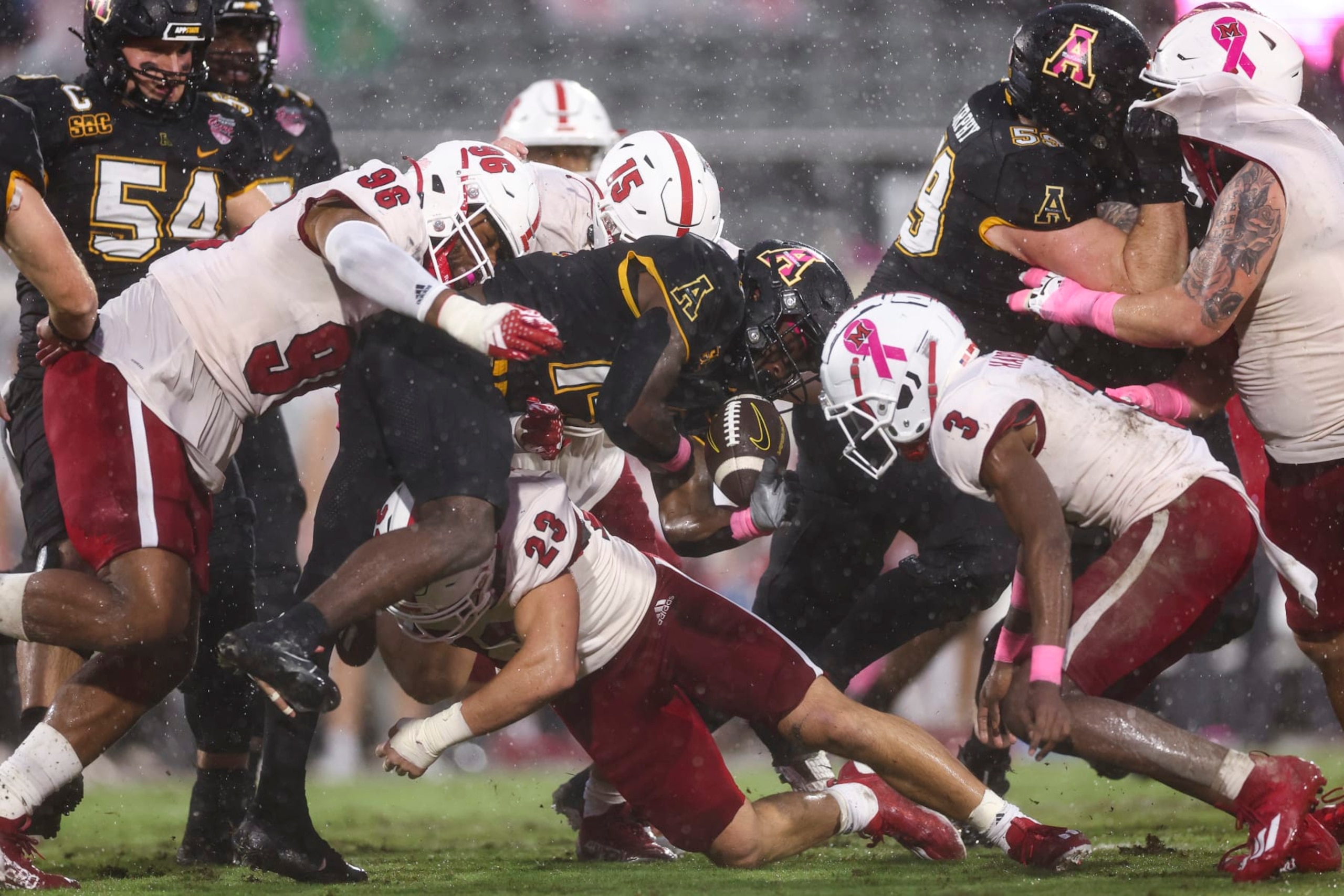 ORLANDO, FLORIDA - DECEMBER 16: Kanye Roberts #14 of the Appalachian State Mountaineers fumbles the ball during the first quarter of The Avocados From Mexico Cure Bowl against the Miami (Oh) Redhawks at FBC Mortgage Stadium on December 16, 2023 in Orlando, Florida. (Photo by Kevin Sabitus/Getty Images) ORLANDO, FLORIDA - DECEMBER 16: Kanye Roberts #14 of the Appalachian State Mountaineers fumbles the ball during the first quarter of The Avocados From Mexico Cure Bowl against the Miami (Oh) Redhawks at FBC Mortgage Stadium on December 16, 2023 in Orlando, Florida. (Photo by Kevin Sabitus/Getty Images)
