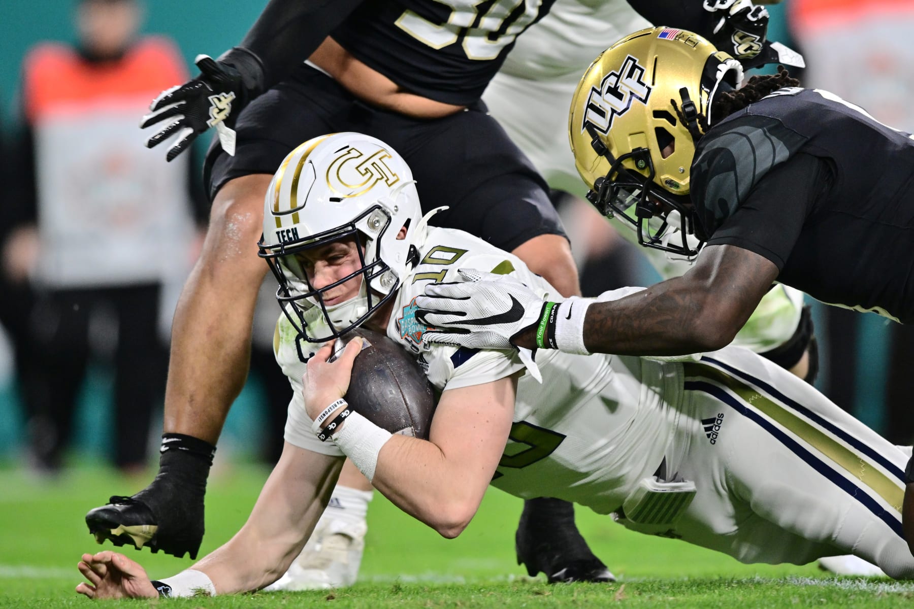 TAMPA, FLORIDA - DECEMBER 22: Haynes King #10 of the Georgia Tech Yellow Jackets stretches for an eight yard gain in the second quarter against the UCF Knights during the 2023 Union Home Mortgage Gasparilla Bowl at Raymond James Stadium on December 22, 2023 in Tampa, Florida. (Photo by Julio Aguilar/Getty Images)