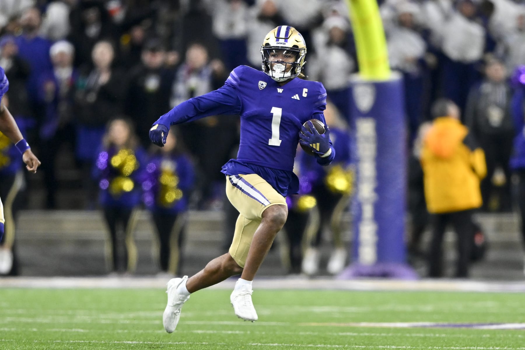 SEATTLE, WASHINGTON - NOVEMBER 25: Rome Odunze #1 of the Washington Huskies runs the ball during the fourth quarter against the Washington State Cougars at Husky Stadium on November 25, 2023 in Seattle, Washington. The Washington Huskies won 24-21. (Photo by Alika Jenner/Getty Images)