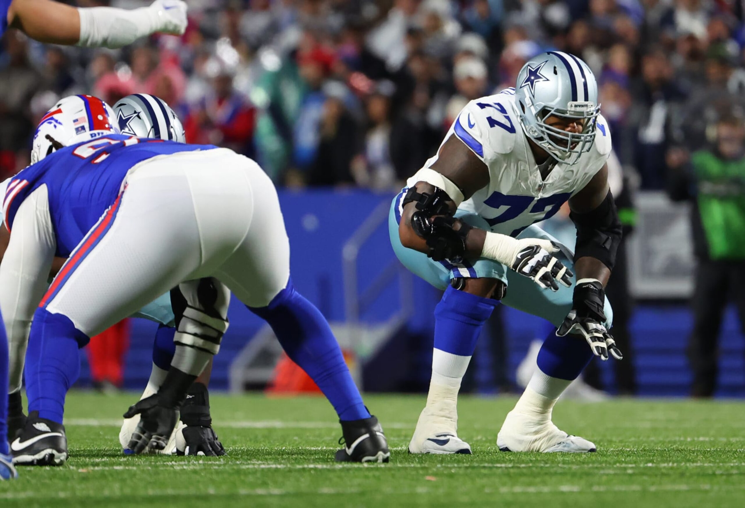 ORCHARD PARK, NEW YORK - DECEMBER 17: Tyron Smith #77 of the Dallas Cowboys waits for the snap against the Buffalo Bills at Highmark Stadium on December 17, 2023 in Orchard Park, New York. (Photo by Timothy T Ludwig/Getty Images) ORCHARD PARK, NEW YORK - DECEMBER 17: Tyron Smith #77 of the Dallas Cowboys waits for the snap against the Buffalo Bills at Highmark Stadium on December 17, 2023 in Orchard Park, New York. (Photo by Timothy T Ludwig/Getty Images)
