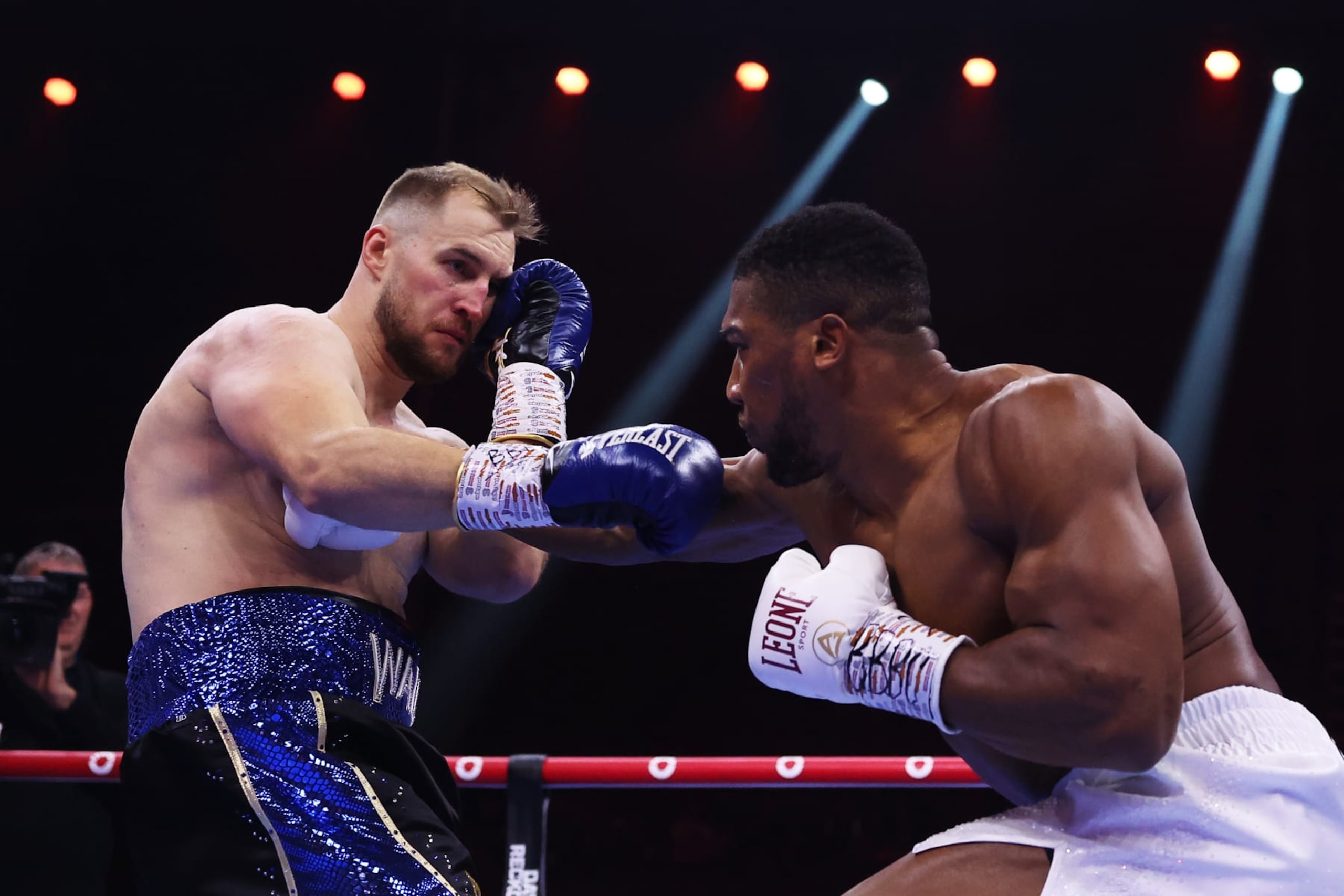 RIYADH, SAUDI ARABIA - DECEMBER 23: Anthony Joshua and Otto Wallin exchange punches during the Heavyweight fight between Anthony Joshua and Otto Wallin during the Day of Reckoning: Fight Night at Kingdom Arena on December 23, 2023 in Riyadh, Saudi Arabia. (Photo by Richard Pelham/Getty Images)