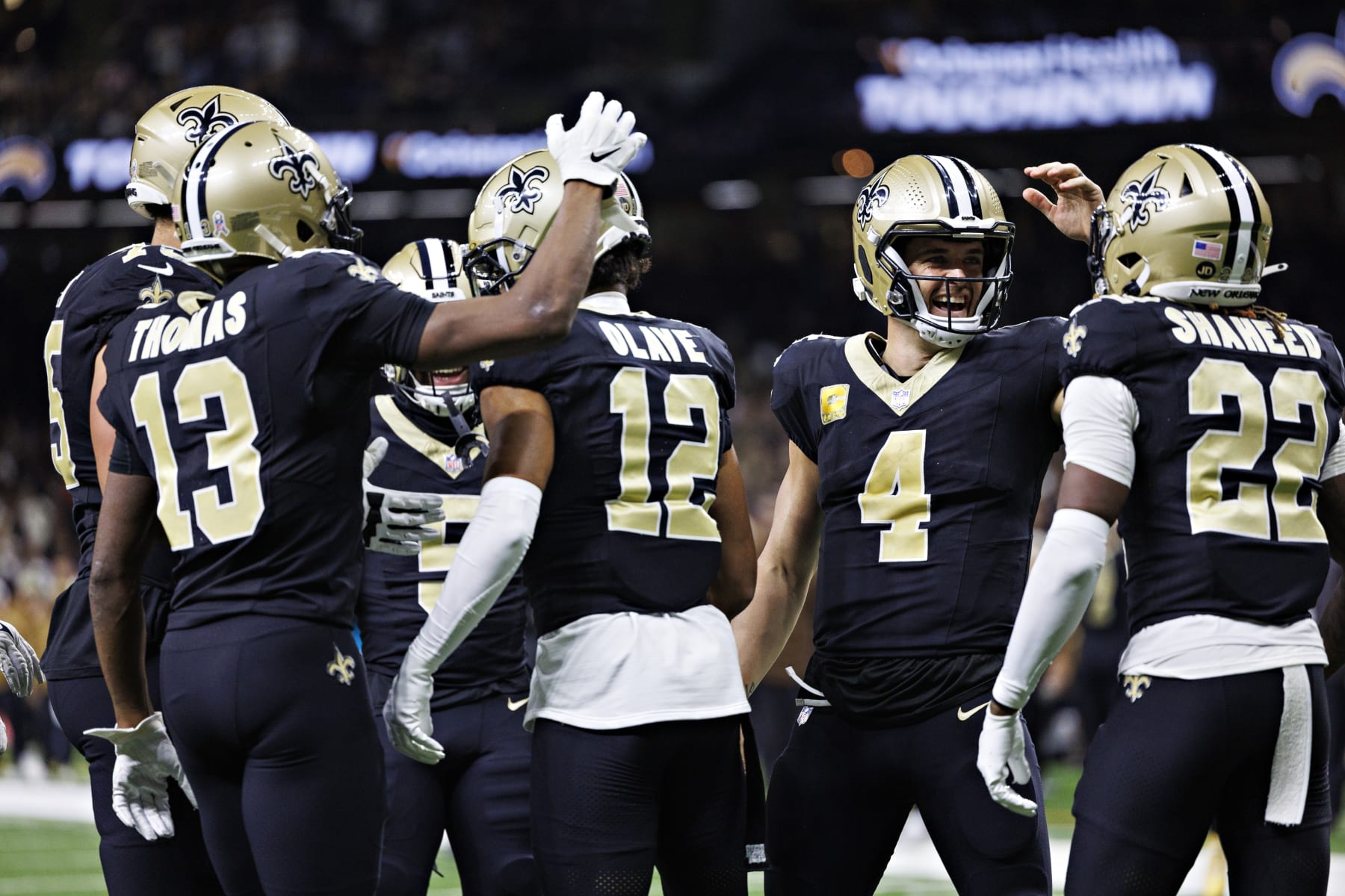 NEW ORLEANS, LOUISIANA - NOVEMBER 05:  Chris Olave #12 and Derek Carr #4 of the New Orleans Saints celebrate after a touchdown during a game against the Chicago Bears at Caesars Superdome on November 5, 2023 in New Orleans, Louisiana. The Saints defeated the Bears 24-17. (Photo by Wesley Hitt/Getty Images)