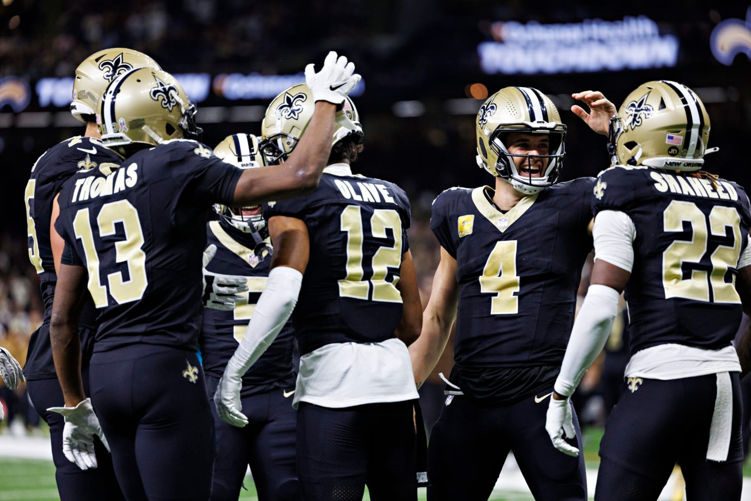 NEW ORLEANS, LOUISIANA - NOVEMBER 05:  Chris Olave #12 and Derek Carr #4 of the New Orleans Saints celebrate after a touchdown during a game against the Chicago Bears at Caesars Superdome on November 5, 2023 in New Orleans, Louisiana. The Saints defeated the Bears 24-17. (Photo by Wesley Hitt/Getty Images)