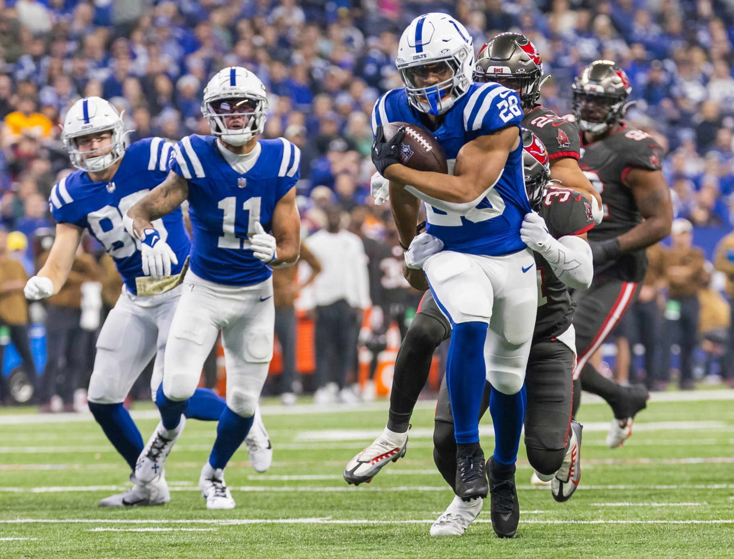 INDIANAPOLIS, INDIANA - NOVEMBER 26: Jonathan Taylor #28 of the Indianapolis Colts runs the ball during the game against the Tampa Bay Buccaneers at Lucas Oil Stadium on November 26, 2023 in Indianapolis, Indiana. (Photo by Michael Hickey/Getty Images) INDIANAPOLIS, INDIANA - NOVEMBER 26: Jonathan Taylor #28 of the Indianapolis Colts runs the ball during the game against the Tampa Bay Buccaneers at Lucas Oil Stadium on November 26, 2023 in Indianapolis, Indiana. (Photo by Michael Hickey/Getty Images)