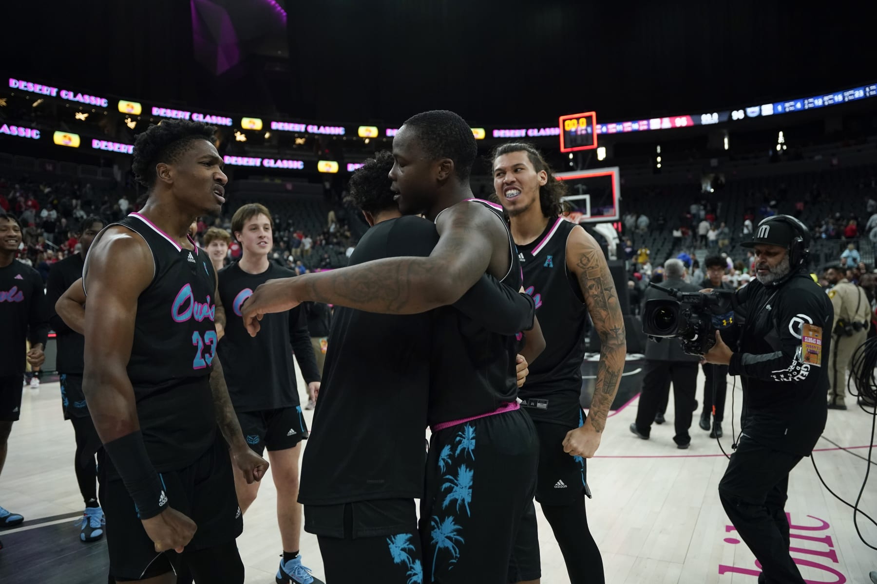 Florida Atlantic celebrates after defeating Arizona in overtime of an NCAA college basketball game Saturday, Dec. 23, 2023, in Las Vegas. (AP Photo/Lucas Peltier)