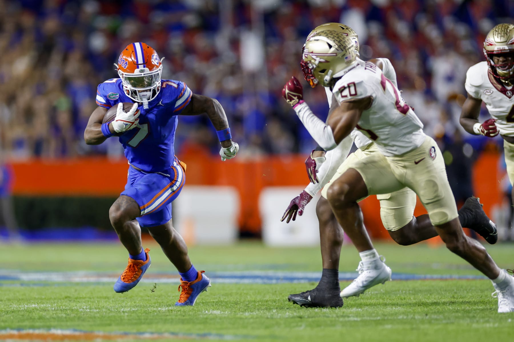 GAINESVILLE, FL - NOVEMBER 25: Florida Gators running back Trevor Etienne (7) runs with the ball during the game between the Florida Gators and the Florida State Seminoles on November 25, 2023 at Ben Hill Griffin Stadium at Florida Field in Gainesville, Fl. (Photo by David Rosenblum/Icon Sportswire via Getty Images)