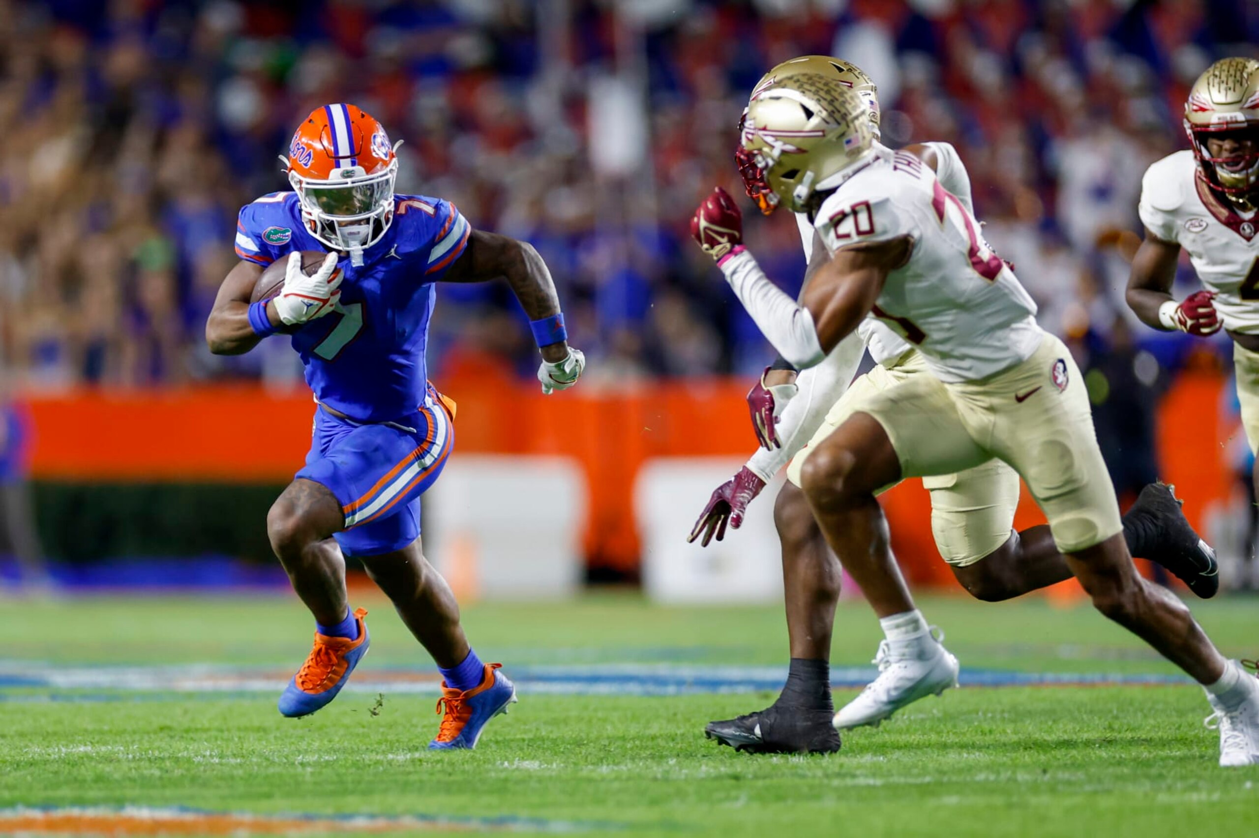 GAINESVILLE, FL - NOVEMBER 25: Florida Gators running back Trevor Etienne (7) runs with the ball during the game between the Florida Gators and the Florida State Seminoles on November 25, 2023 at Ben Hill Griffin Stadium at Florida Field in Gainesville, Fl. (Photo by David Rosenblum/Icon Sportswire via Getty Images)