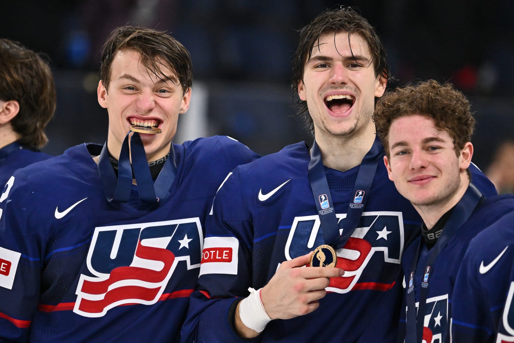 HALIFAX, CANADA - JANUARY 05:  Rutger Mcgroarty #2, Cutter Gauthier #17 and Gavin Brindley #5 of Team United States pose with their bronze medals after defeating Team Sweden 8-7 in overtime in the bronze medal round of the 2023 IIHF World Junior Championship at Scotiabank Centre on January 5, 2023 in Halifax, Nova Scotia, Canada.  (Photo by Minas Panagiotakis/Getty Images)