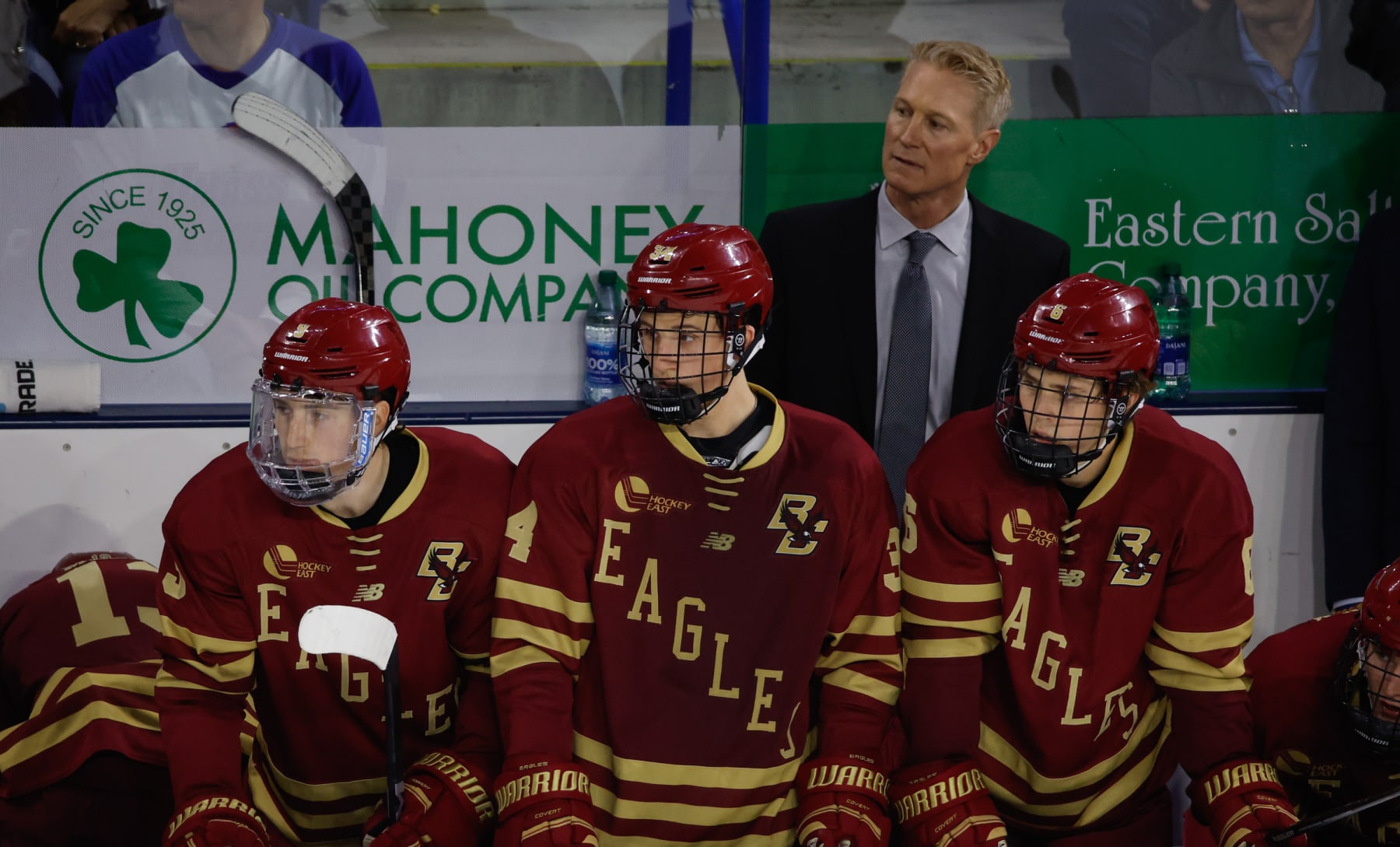 LOWELL, MASSACHUSETTS - NOVEMBER 4: Ryan Leonard #9 of the Boston College Eagles (left) and his teammates Gabe Perreault #34 (middle) and Will Smith #6 stand on the bench during a game against the UMass Lowell River Hawks in NCAA men's hockey at the Tsongas Center on November 4, 2023 in Lowell, Massachusetts. Leonard, Perreault and Smith were all 1st-round NHL draft picks in the 2023 draft and are currently linemates. The Eagles won 3-2. (Photo by Richard T Gagnon/Getty Images)