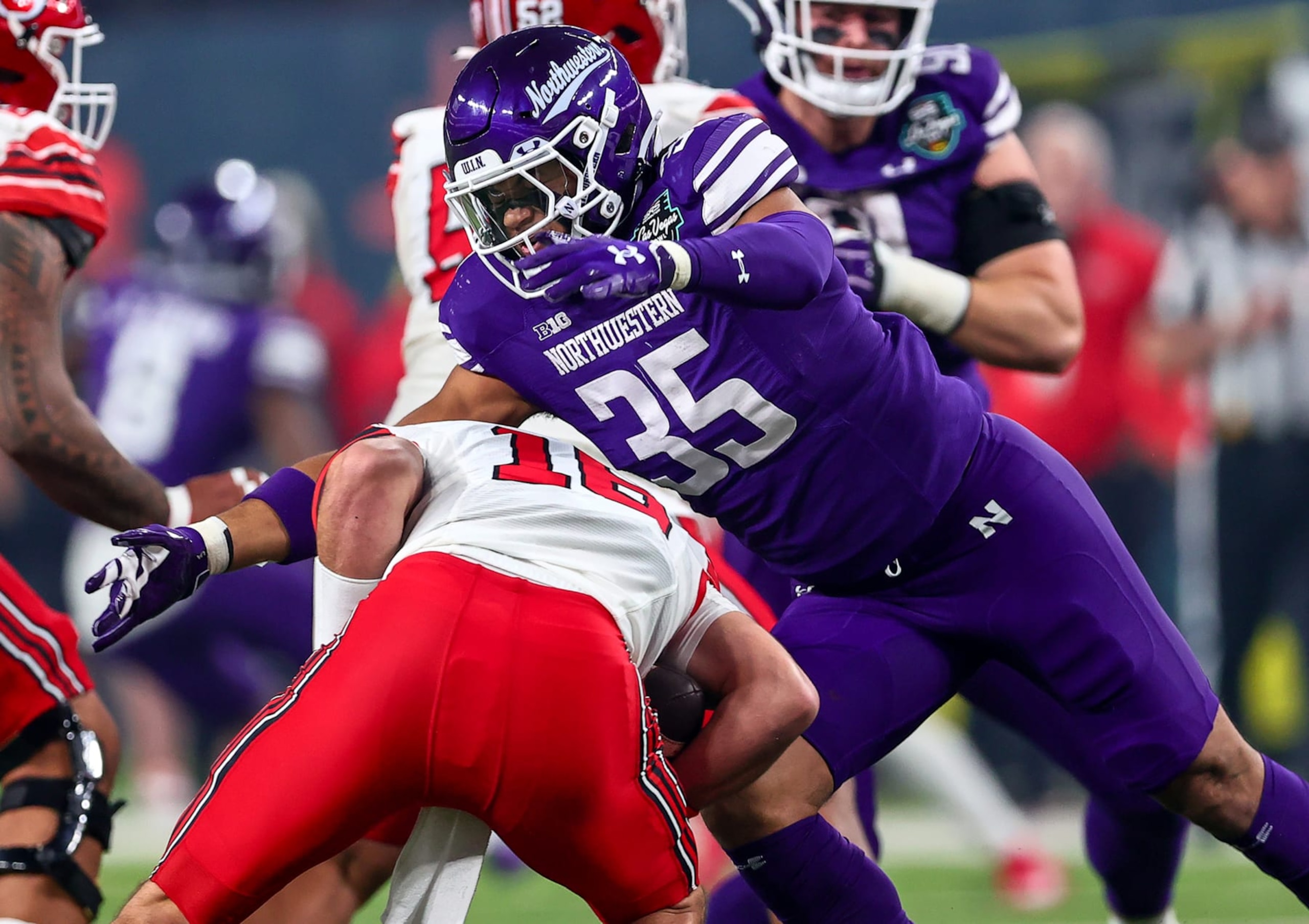 LAS VEGAS, NV - DECEMBER 23: Northwestern Wildcats linebacker Kenny Soares Jr (35) sacks Utah Utes quarterback quarterback Bryson Barnes (16) during the first half of the SRS Distribution Las Vegas Bowl played between the Utah Utes and the Northwestern Wildcats on December 23, 2023 at Allegiant Stadium in Las Vegas, Nevada. (Photo by Steve Nurenberg/Icon Sportswire via Getty Images) LAS VEGAS, NV - DECEMBER 23: Northwestern Wildcats linebacker Kenny Soares Jr (35) sacks Utah Utes quarterback quarterback Bryson Barnes (16) during the first half of the SRS Distribution Las Vegas Bowl played between the Utah Utes and the Northwestern Wildcats on December 23, 2023 at Allegiant Stadium in Las Vegas, Nevada. (Photo by Steve Nurenberg/Icon Sportswire via Getty Images)