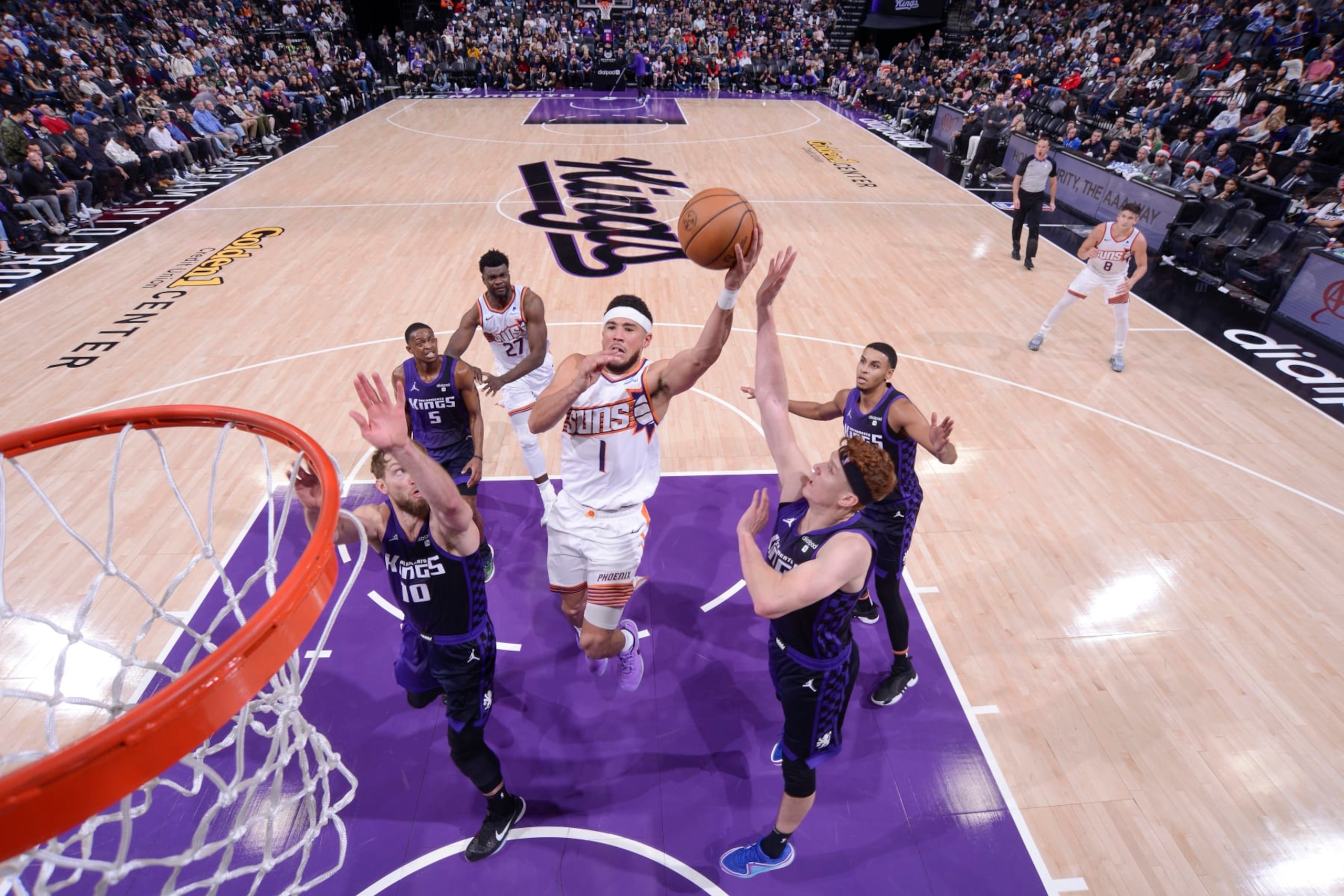 SACRAMENTO, CA - DECEMBER 22:  Devin Booker #1 of the Phoenix Suns goes to the basket during the game on December 22, 2023 at Golden 1 Center in Sacramento, California. NOTE TO USER: User expressly acknowledges and agrees that, by downloading and or using this Photograph, user is consenting to the terms and conditions of the Getty Images License Agreement. Mandatory Copyright Notice: Copyright 2023 NBAE (Photo by Rocky Widner/NBAE via Getty Images)