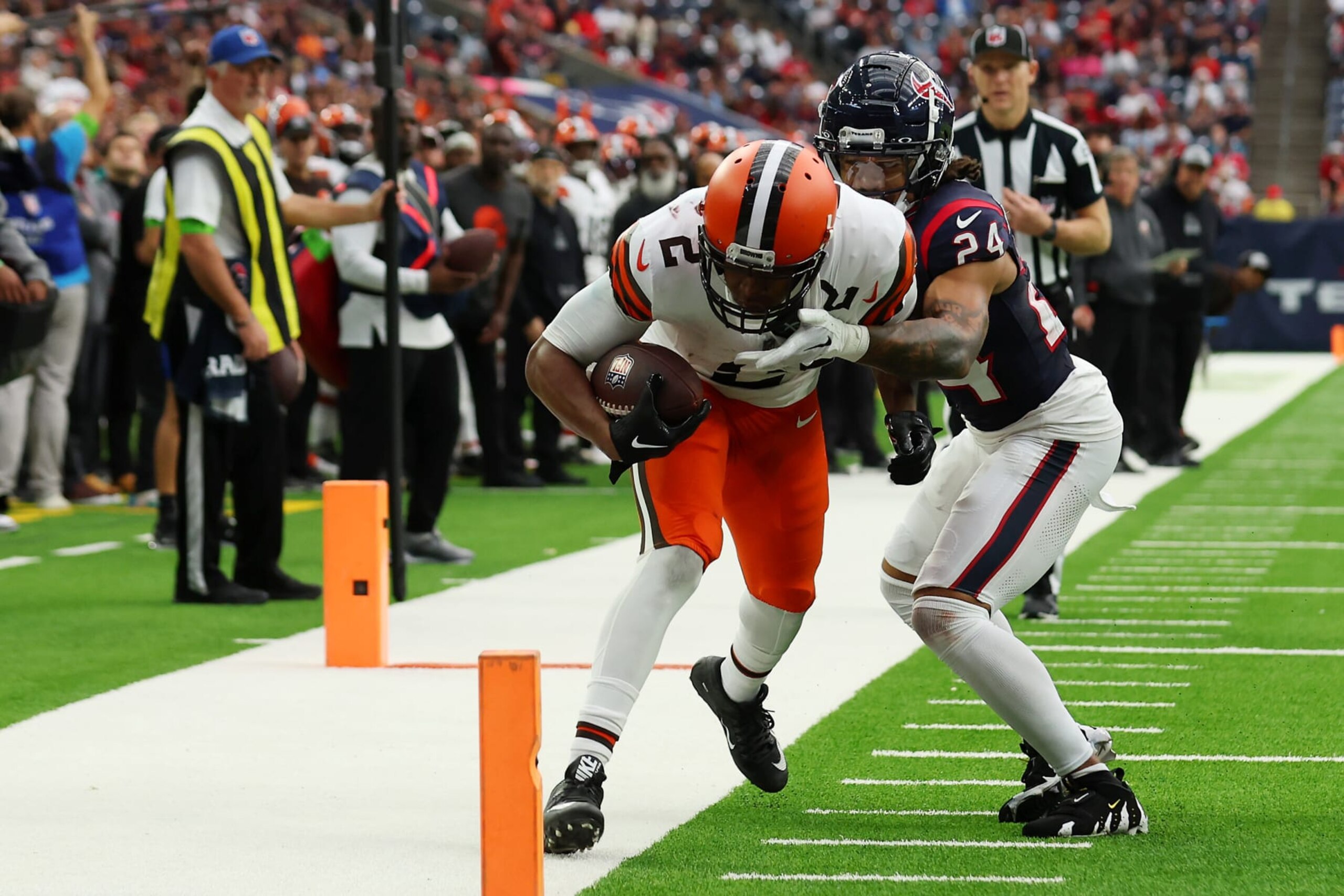 HOUSTON, TEXAS - DECEMBER 24:  Amari Cooper #2 of the Cleveland Browns is pushed out of bounds by Derek Stingley Jr. #24 of the Houston Texans during the third quarter at NRG Stadium on December 24, 2023 in Houston, Texas. (Photo by Richard Rodriguez/Getty Images)